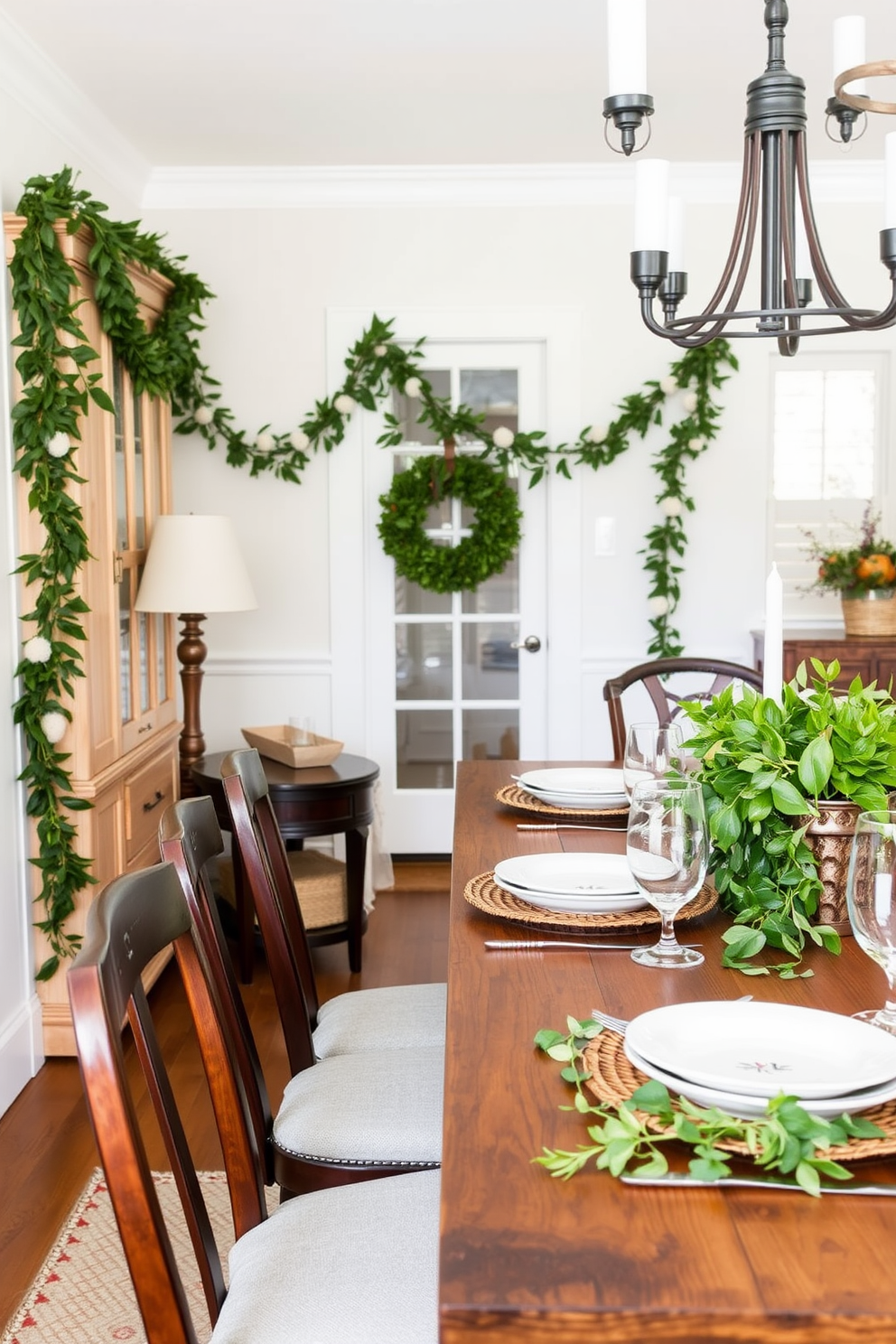 A charming dining room adorned with simple greenery garlands draped elegantly along a long wooden table. The table is set with rustic ceramic plates and glassware, creating a warm and inviting atmosphere for a Labor Day gathering.