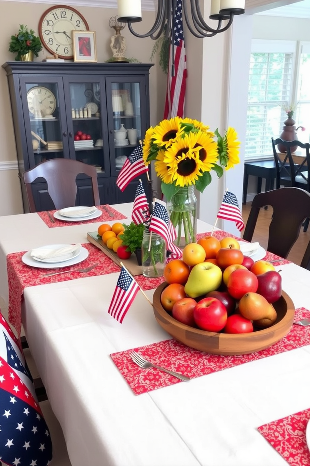 A beautifully arranged dining table showcasing seasonal fruits as decor. A vibrant display of apples, oranges, and pears is artfully placed in a rustic wooden bowl at the center of the table. Labor Day themed dining room decorated with festive elements. Red, white, and blue table linens are complemented by small American flags and a centerpiece of sunflowers in a mason jar.