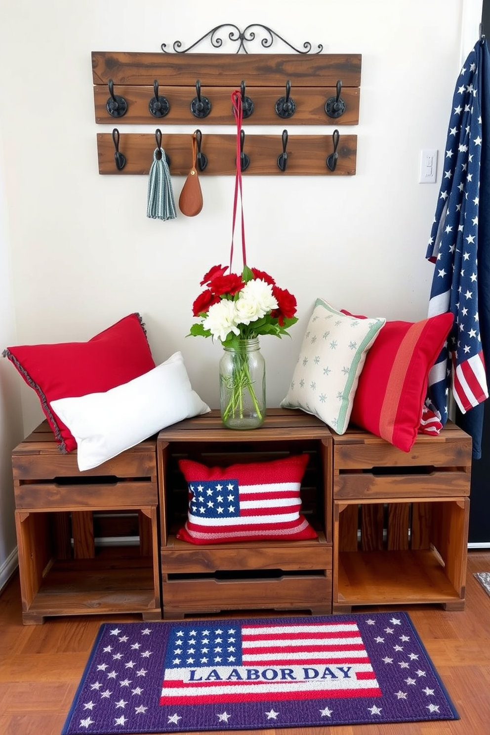 Wooden crates are arranged neatly in the entryway, providing stylish storage solutions while adding a rustic charm. Above the crates, a wall-mounted coat rack features vintage hooks, complementing the warm tones of the wood. For Labor Day, the entryway is adorned with red, white, and blue accents, including a patriotic welcome mat and decorative pillows. Fresh flowers in a mason jar sit atop the crates, creating a welcoming atmosphere for guests.