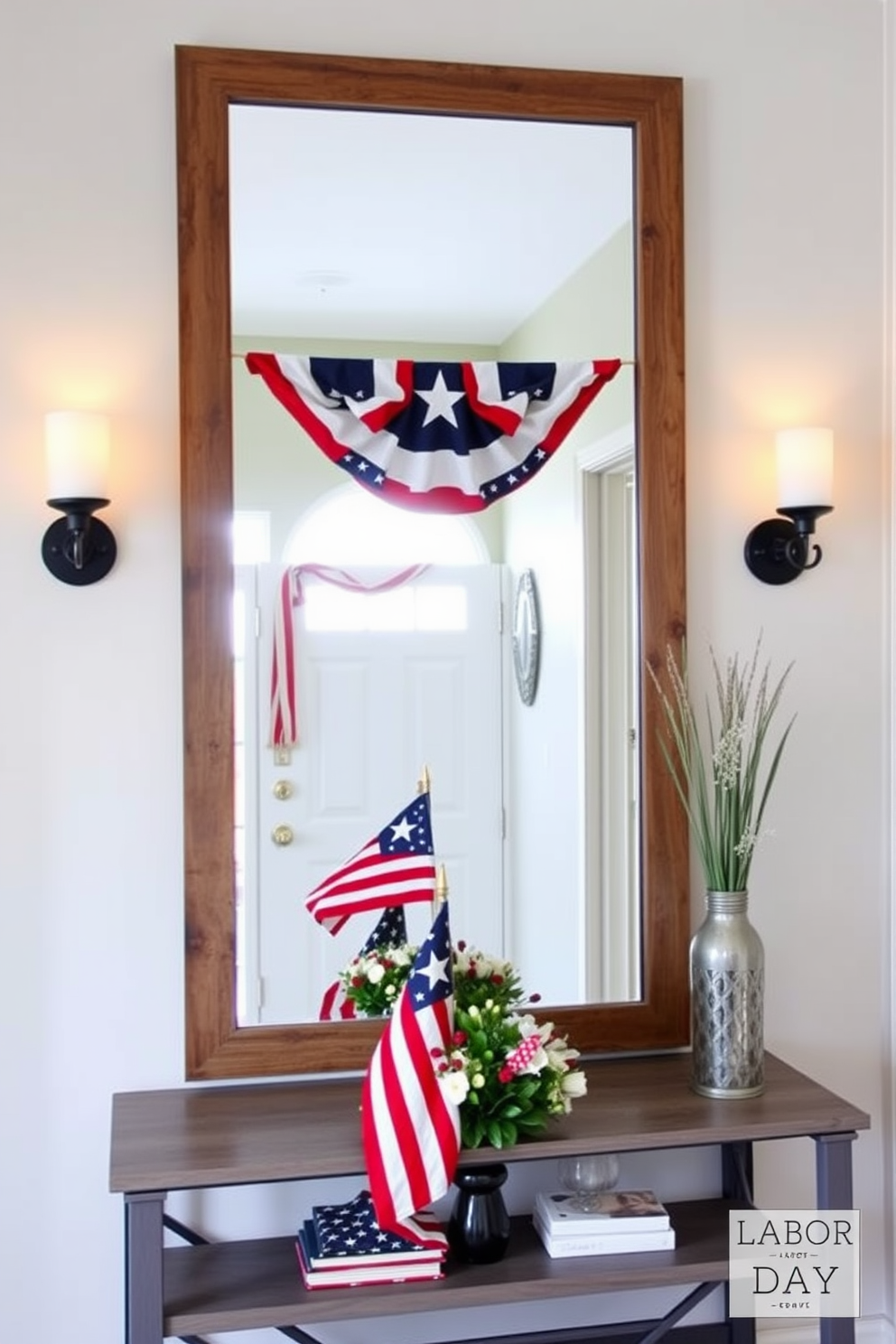 A welcoming entryway features a large mirror framed with rustic wood and adorned with patriotic accents. Flanking the mirror are two decorative wall sconces that cast a warm glow, enhancing the inviting atmosphere. The space is accented with a vibrant red, white, and blue color scheme, reflecting the spirit of Labor Day. A stylish console table beneath the mirror displays seasonal decor, including a small flag and a bouquet of fresh flowers.