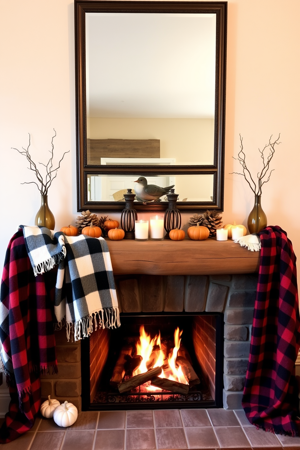 Cozy plaid blankets are draped over a rustic wooden mantel, creating a warm and inviting atmosphere. The fireplace is adorned with autumn-themed decorations, including small pumpkins and candles that flicker softly. Above the mantel, a large framed mirror reflects the glow of the fire, enhancing the cozy ambiance. The surrounding walls are painted in a soft cream color, complementing the rich tones of the blankets and the natural wood of the mantel.