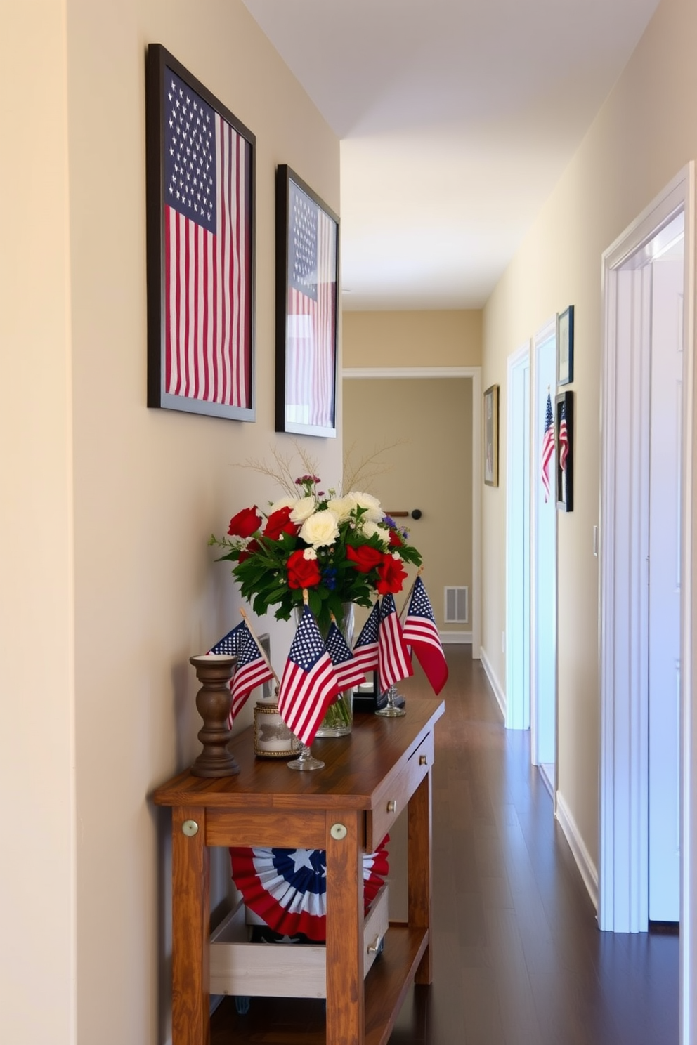 A hallway adorned with framed American flag artwork creates a patriotic atmosphere. The walls are painted in a soft beige to complement the vibrant colors of the flags. Along the hallway, a series of decorative elements celebrate Labor Day. A rustic wooden console table holds a collection of red, white, and blue accents, including small flags and seasonal flowers in a vase.