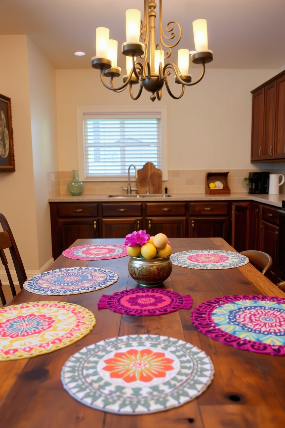 A vibrant kitchen setting that showcases colorful placemats on a rustic wooden dining table. The placemats feature bold patterns and bright colors, adding a cheerful touch to the space. Above the table, a stylish chandelier with warm lighting illuminates the area. The walls are painted in a soft cream color, complementing the rich brown tones of the wooden cabinets.