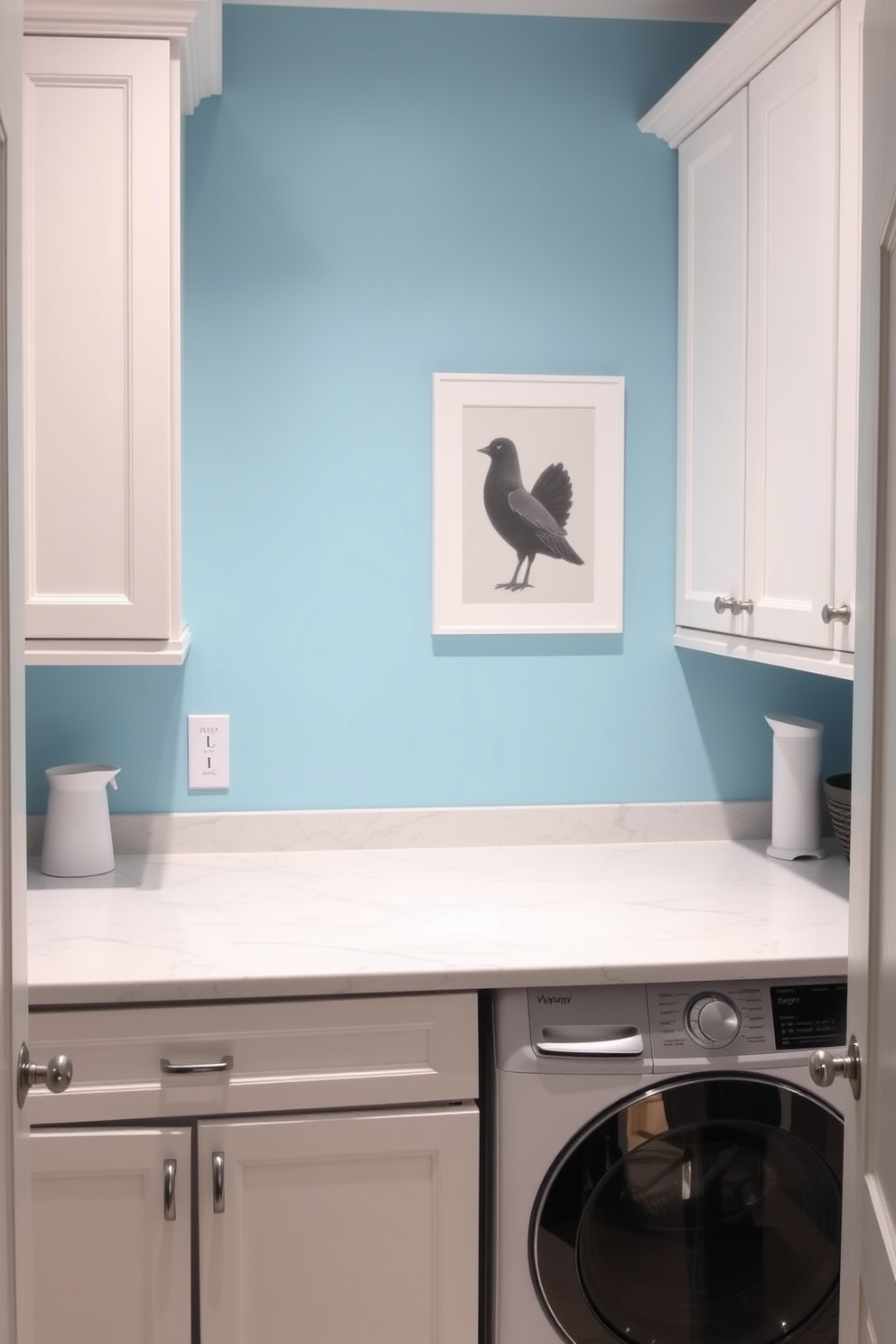 A bright and functional laundry room features a spacious countertop for folding clothes made of durable quartz. The walls are painted in a cheerful light blue, complemented by white cabinetry that provides ample storage for laundry essentials.