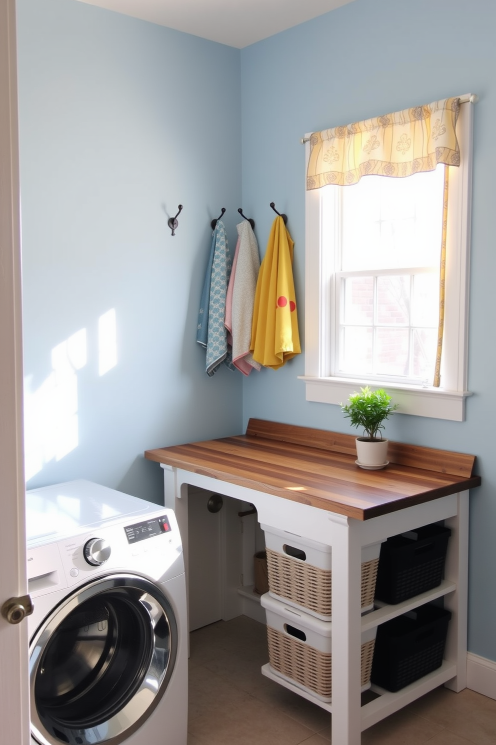 A bright and functional laundry room with ample natural light streaming through a window adorned with a decorative curtain for privacy. The walls are painted in a soft blue hue, and the space features a sleek white washer and dryer stacked with stylish storage baskets beside them. A charming countertop made of reclaimed wood provides space for folding laundry, complemented by a small potted plant for a touch of greenery. Decorative wall hooks are arranged above the countertop, showcasing colorful towels and laundry bags for added convenience and style.