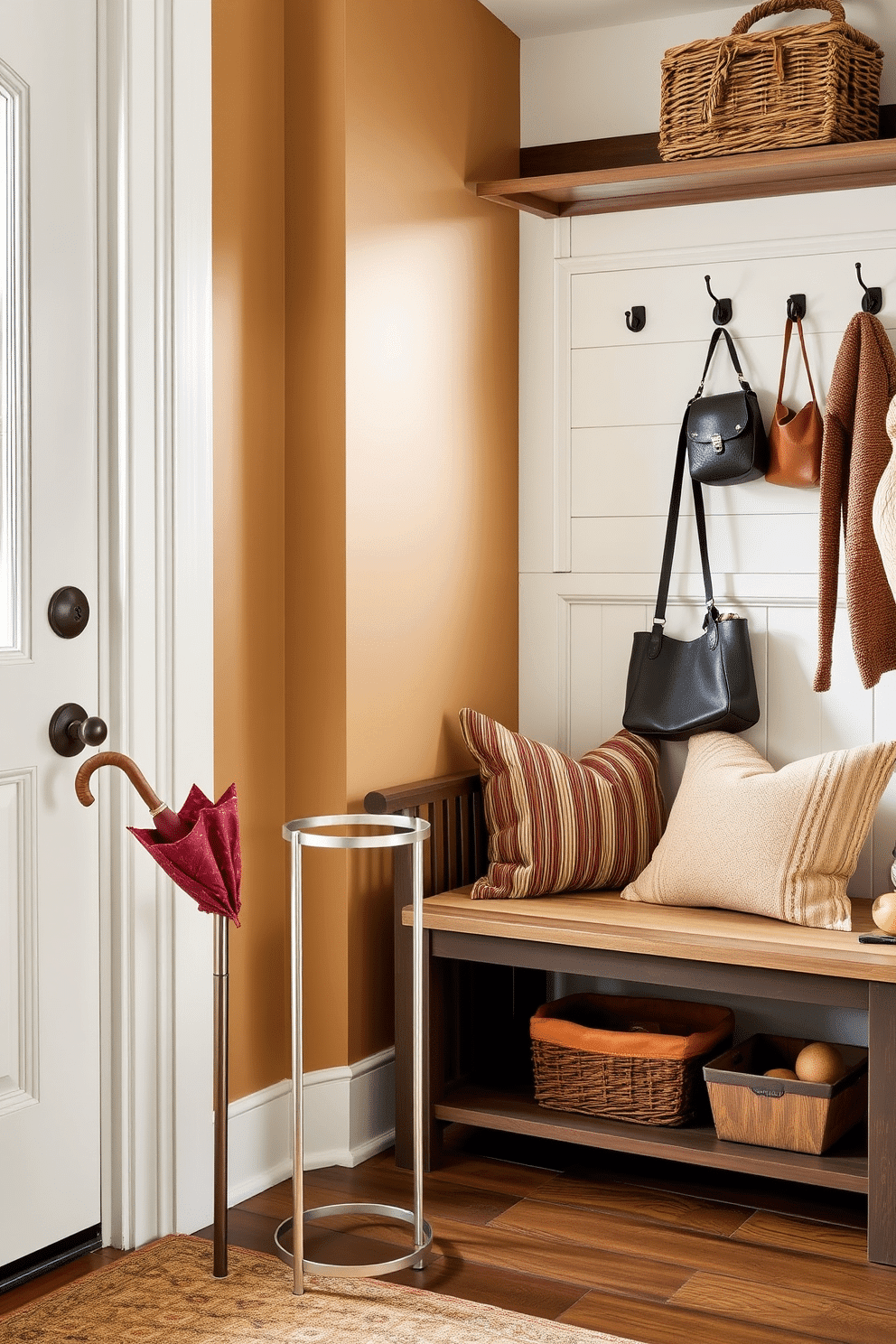 A stylish umbrella stand is positioned by the entrance, crafted from sleek metal with a modern design. It features a minimalist aesthetic that complements the surrounding decor while providing functional storage for umbrellas. The Labor Day mudroom is decorated with a warm color palette, incorporating earthy tones and rustic elements. A cozy bench with plush cushions invites guests to sit, while hooks on the wall provide a convenient place for coats and bags.