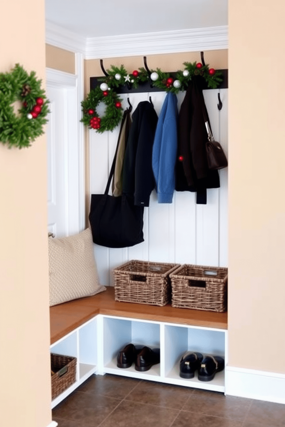 A functional mudroom features wall-mounted coat hooks for easy access to outerwear. The space is adorned with a cozy bench and storage baskets to keep footwear organized and ready for use. The walls are painted in a warm neutral tone, complemented by a durable tile floor that can withstand heavy traffic. Seasonal decorations, such as garlands or wreaths, add a festive touch while maintaining a clean and inviting atmosphere.