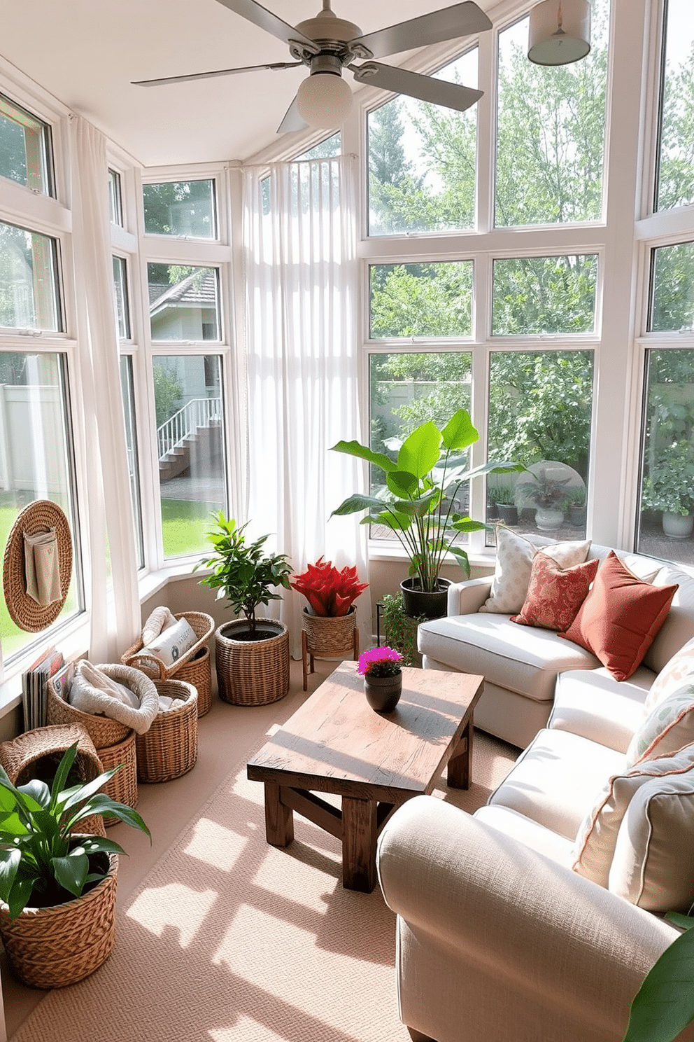 A sunroom filled with natural light featuring large windows adorned with sheer white curtains. In one corner, stylish woven baskets are used to store cozy blankets and magazines, adding a touch of warmth and organization. The seating area includes a comfortable sectional sofa in soft beige, complemented by colorful throw pillows. A rustic wooden coffee table sits in the center, surrounded by potted plants that bring a vibrant, fresh feel to the space.