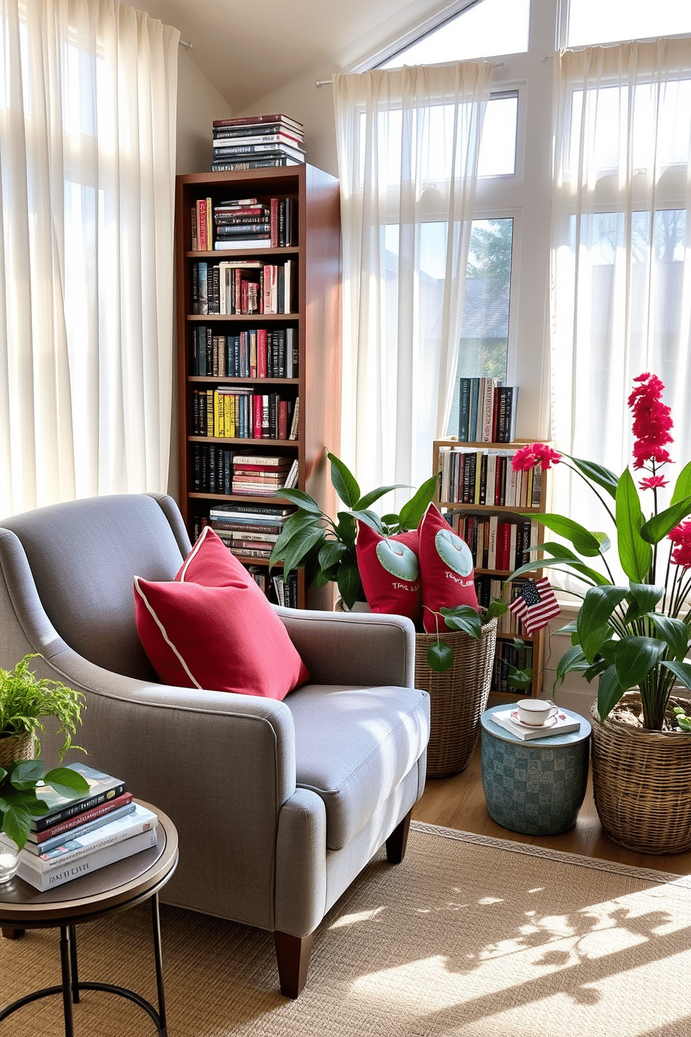 A cozy reading nook with a plush armchair upholstered in soft gray fabric. A small round side table holds a steaming cup of tea and a stack of well-loved books beside a tall bookshelf filled with colorful titles. Labor Day sunroom decorated with vibrant throw pillows in red and blue hues. Large potted plants add a touch of greenery, while sheer curtains gently filter the sunlight streaming through the expansive windows.