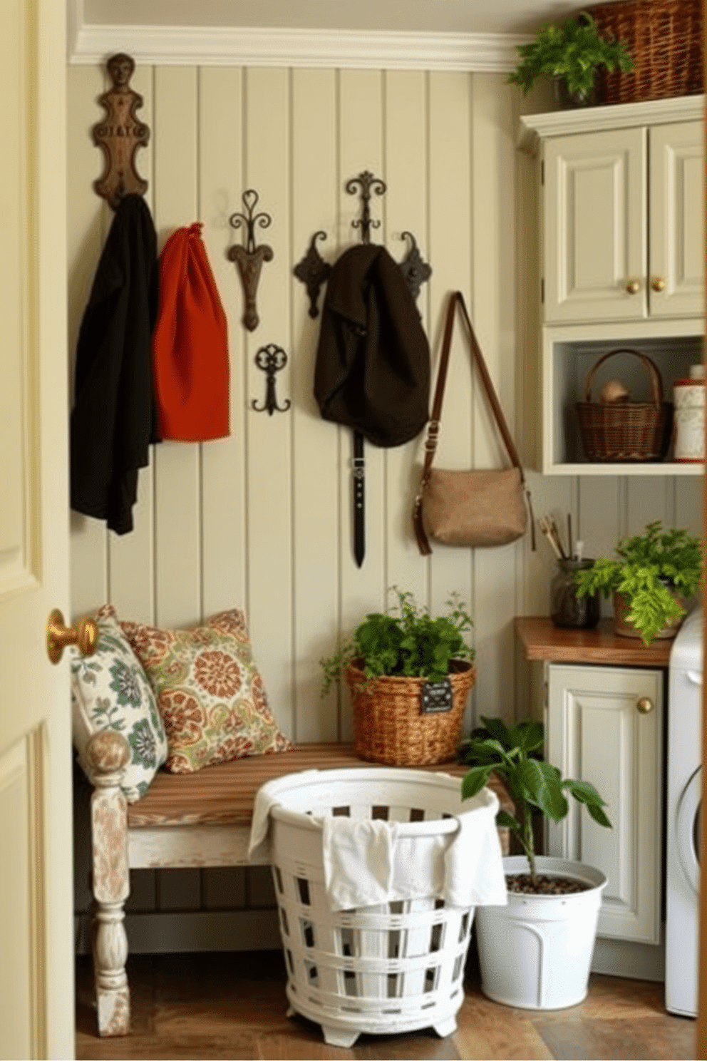 A cozy laundry mudroom features vintage accents that evoke a charming feel. The space includes a distressed wooden bench with colorful patterned cushions, while a collection of antique hooks adorns the wall for hanging coats and bags. The cabinetry is painted in a soft pastel hue, complemented by brass hardware that adds a touch of elegance. A vintage-inspired laundry basket sits in the corner, and potted plants bring a touch of greenery to the inviting atmosphere.