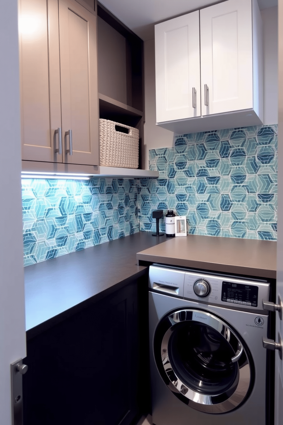 A chic laundry room featuring a stylish backsplash design that adds a pop of color and texture. The space includes a stacked washer and dryer, seamlessly integrated into cabinetry with sleek, modern hardware. The walls are painted in a soft, neutral tone, while the backsplash showcases vibrant tiles in a geometric pattern. A countertop above the appliances provides ample space for folding laundry, accented by decorative storage baskets for organization.