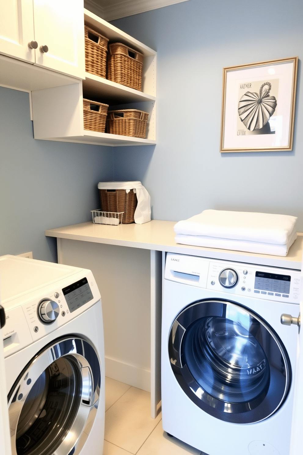 A functional laundry room layout features a top-loading washer positioned next to a spacious folding station with ample countertop space. The walls are painted a soft blue, and open shelving above the folding station holds neatly organized baskets and laundry supplies.