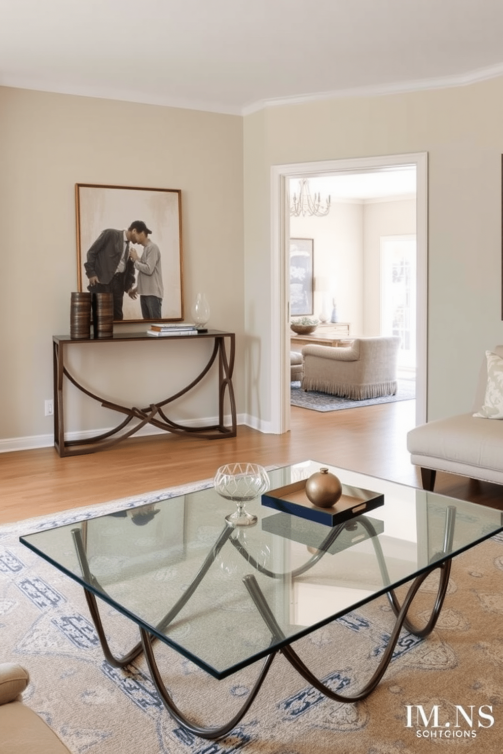 A unique coffee table as a centerpiece. It features an asymmetrical design with a glass top and a sculptural base made of intertwined metal. The living room entryway is designed to be inviting and functional. A stylish console table against the wall displays decorative items, while a large mirror reflects natural light, enhancing the space's openness.