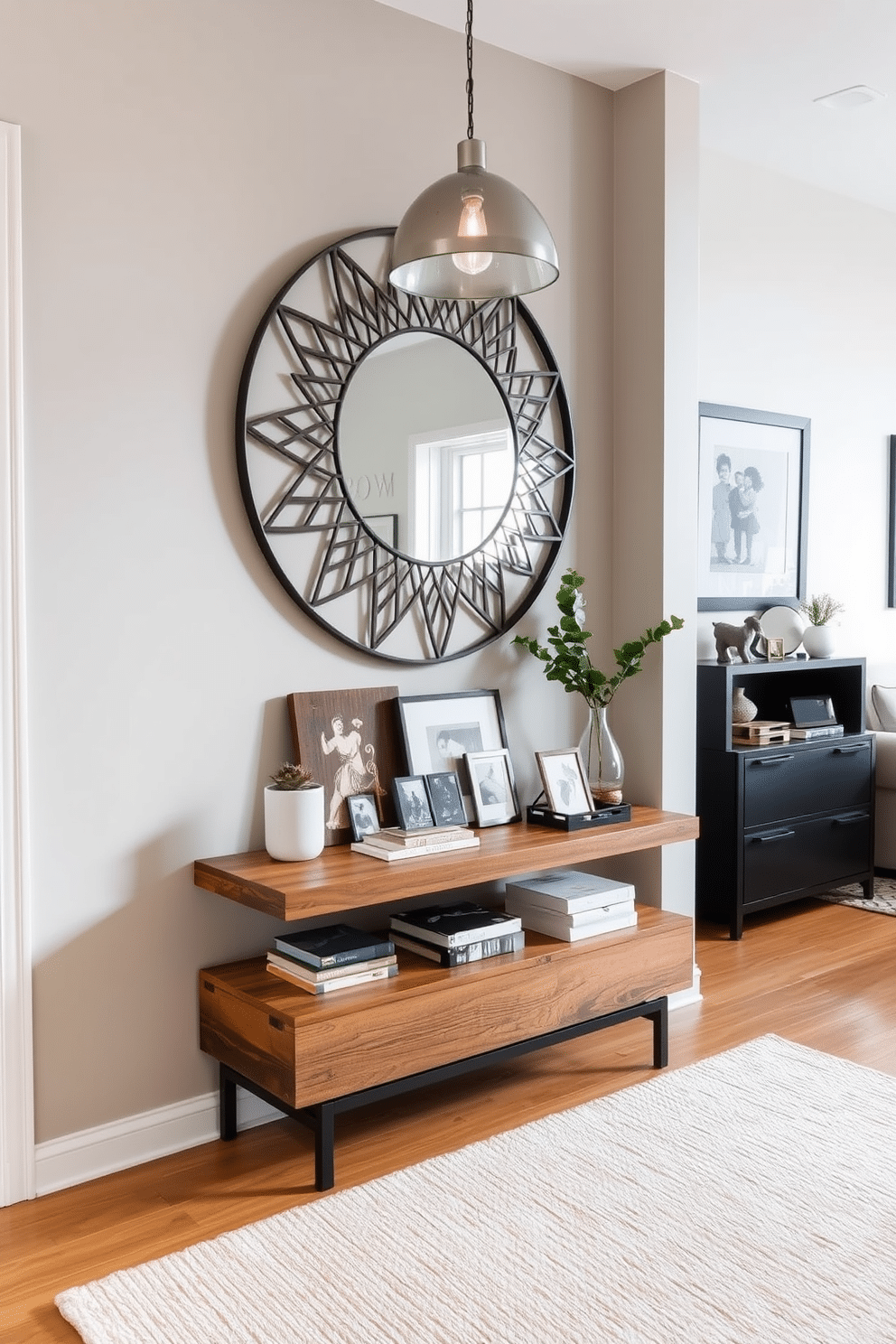 A stylish living room entryway features a sleek console table made of reclaimed wood, adorned with a collection of personalized decor items that reflect the homeowner's character. Above the table, a large round mirror with an intricate frame creates a focal point, while a small potted plant adds a touch of greenery and warmth to the space. The entryway is illuminated by a modern pendant light that casts a soft glow, enhancing the inviting atmosphere. A textured area rug in neutral tones anchors the space, complementing the warm wood flooring and providing a cozy transition into the living area.