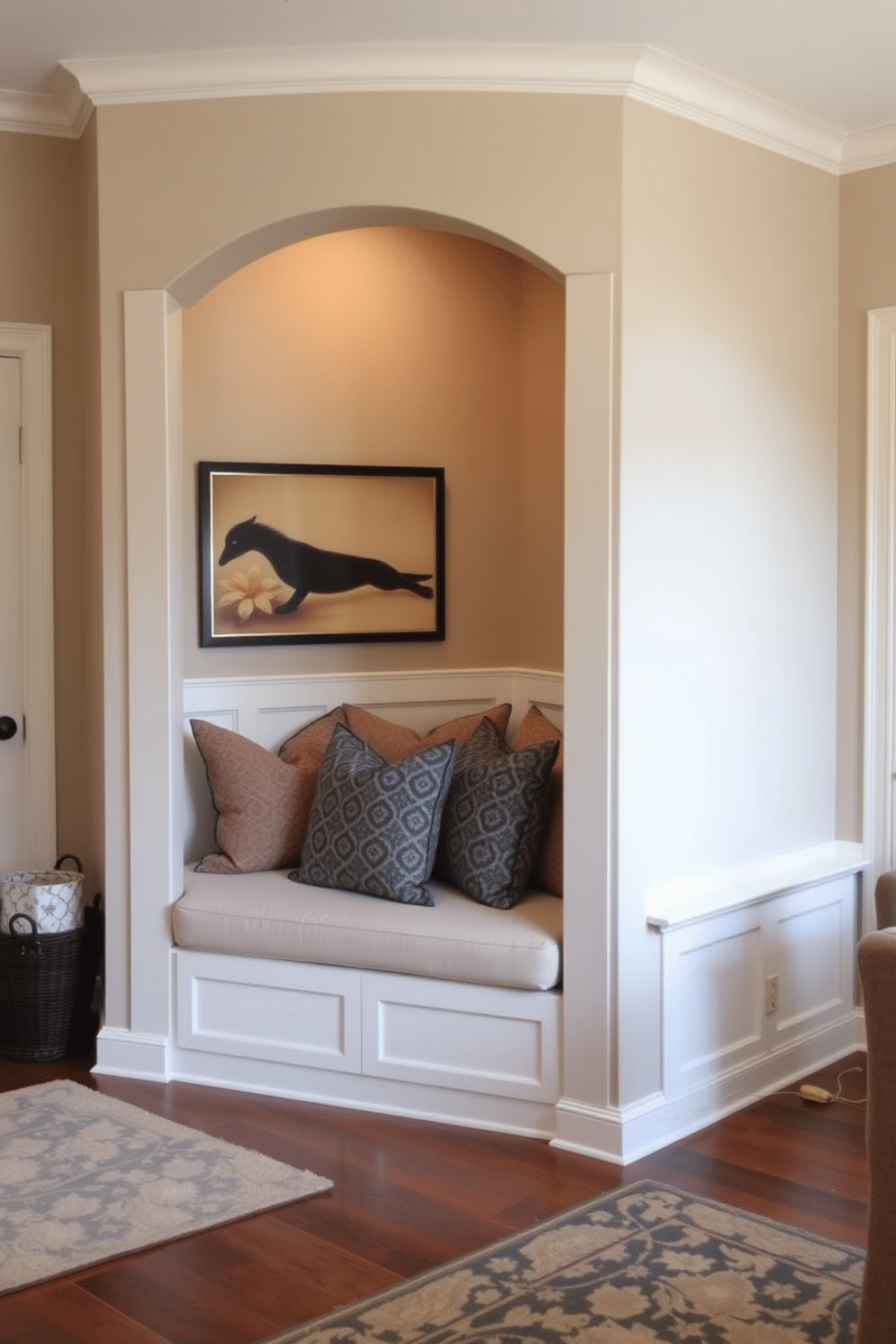 A cozy living room entryway features customized built-in seating that seamlessly blends with the surrounding decor. The seating is upholstered in a soft, neutral fabric, accented with colorful throw pillows, creating an inviting space for relaxation and conversation.