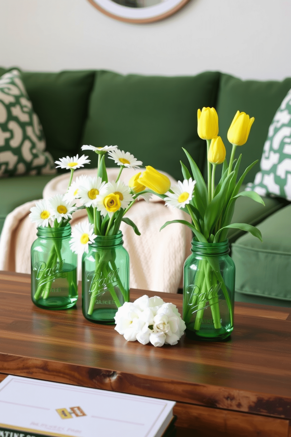 A cozy living room adorned for St. Patrick's Day features green mason jar vases filled with fresh white daisies and vibrant yellow tulips, bringing a cheerful touch to the space. The vases are strategically placed on a rustic wooden coffee table, complemented by a soft, cream-colored throw blanket draped over a plush green sofa.