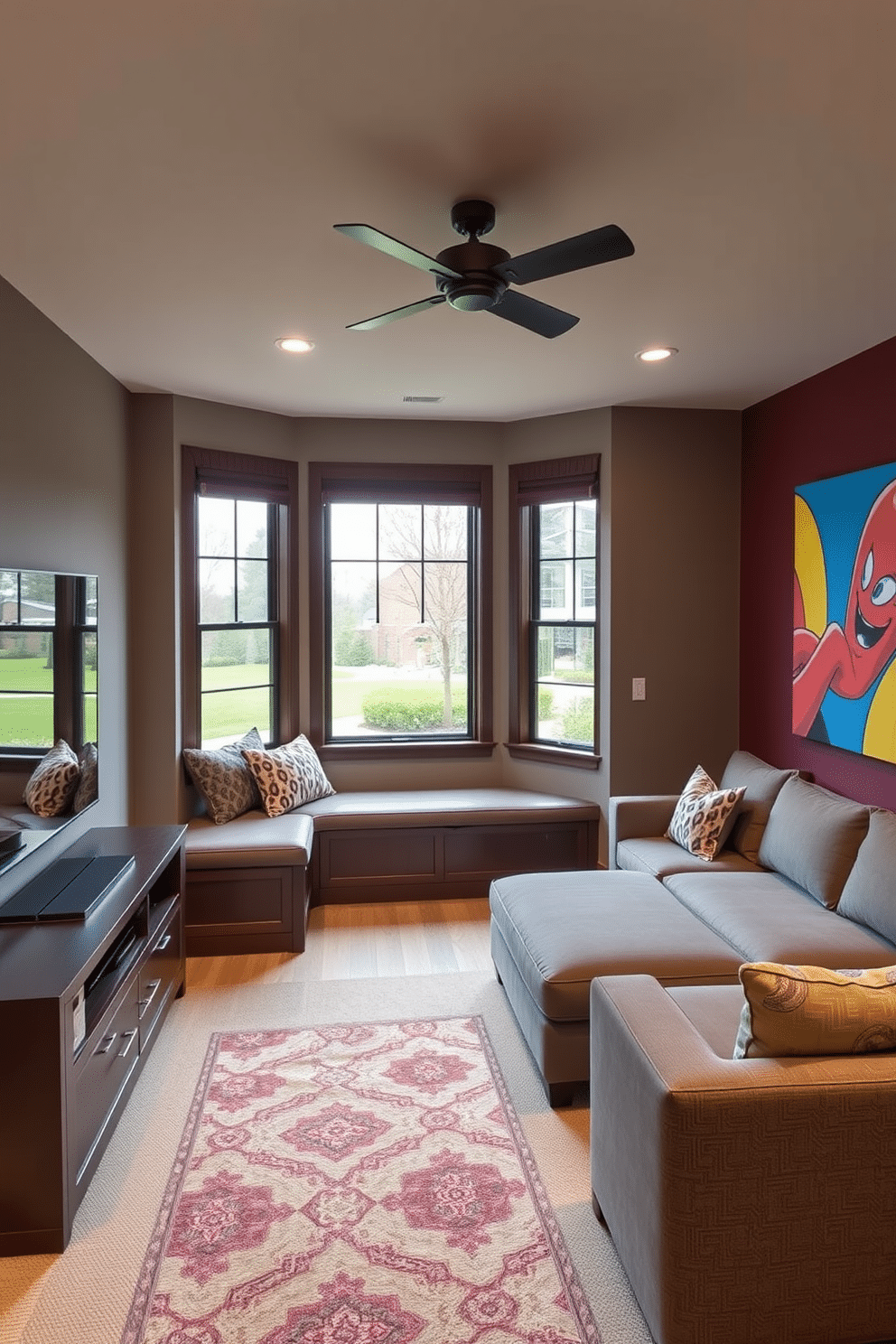 A cozy media game room features a cushioned window seat that provides additional seating while offering a view of the outdoors. The room is designed with a large sectional sofa, a sleek entertainment center, and vibrant wall art that reflects a playful and inviting atmosphere.