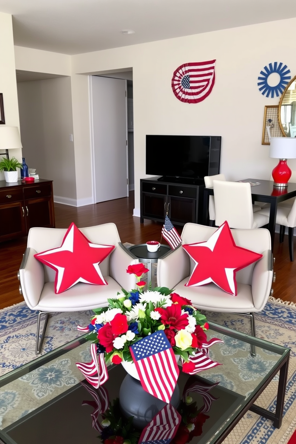 Star-shaped decorative pillows are arranged on a pair of modern chairs in a cozy living room. The pillows feature a vibrant color palette that adds a playful touch to the space. For Memorial Day, the apartment is adorned with red, white, and blue accents throughout the decor. A festive arrangement of flowers in patriotic colors sits on the coffee table, enhancing the celebratory atmosphere.