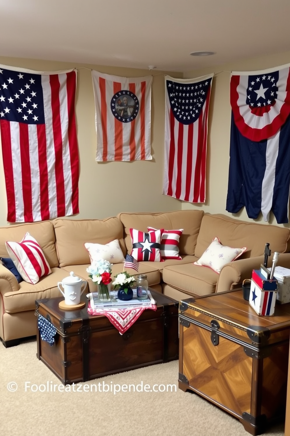 A cozy basement decorated for Memorial Day features vintage flag banners hanging on the walls, creating a festive atmosphere. The space is filled with comfortable seating, including a large sectional sofa adorned with red, white, and blue throw pillows, and a coffee table displaying patriotic decorations. The walls are painted in a soft beige, providing a warm backdrop for the vibrant banners. A vintage trunk serves as a unique storage solution and adds character to the room, enhancing the overall theme of remembrance and celebration.