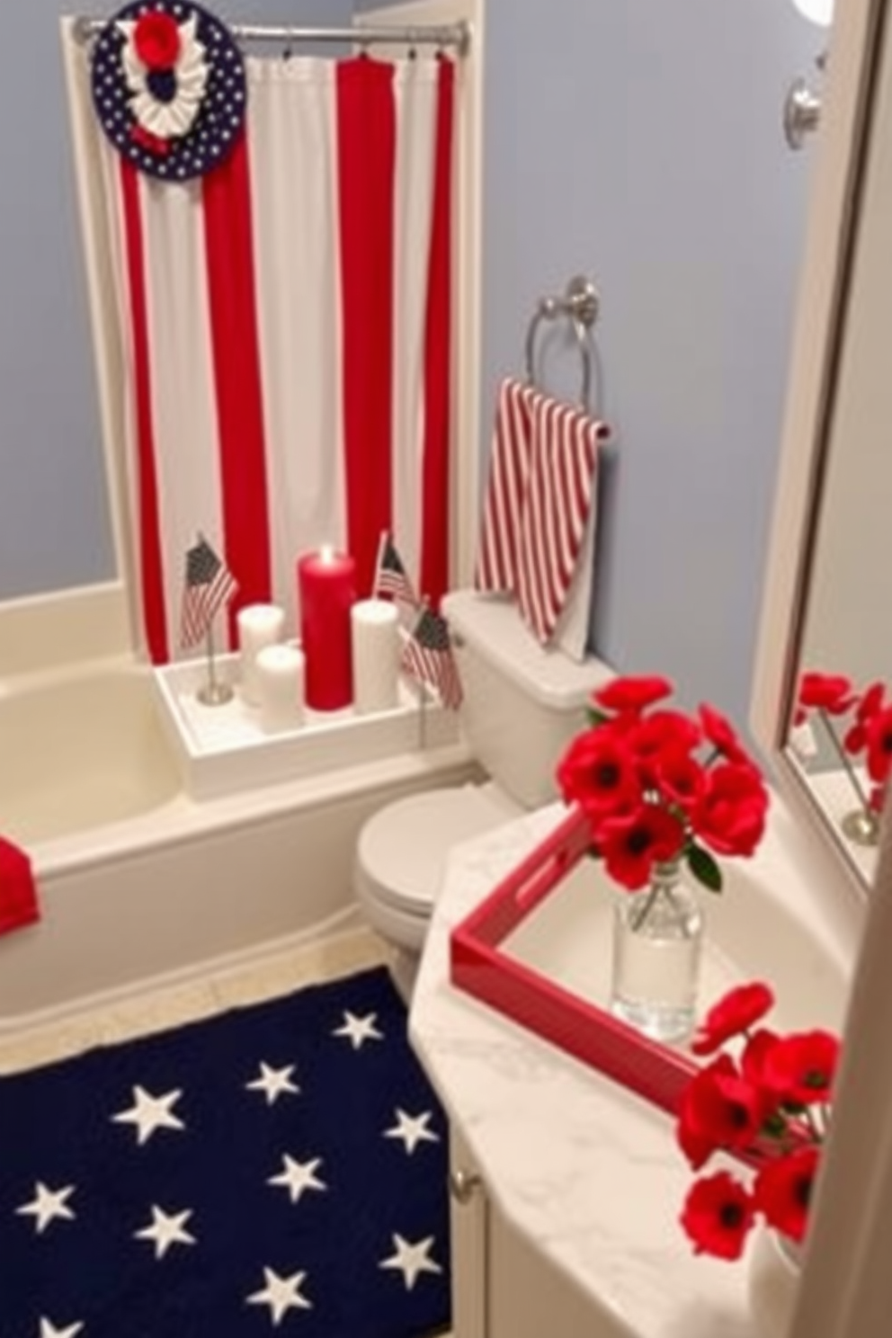 A Memorial Day-themed bathroom adorned with decorative trays in patriotic colors. The trays are placed on a white marble countertop, holding red, white, and blue candles, along with small American flags. The walls are painted in a soft blue hue, complementing the red and white striped shower curtain. A navy blue rug with white stars lies in front of the sink, and a vase with red poppies adds a festive touch.