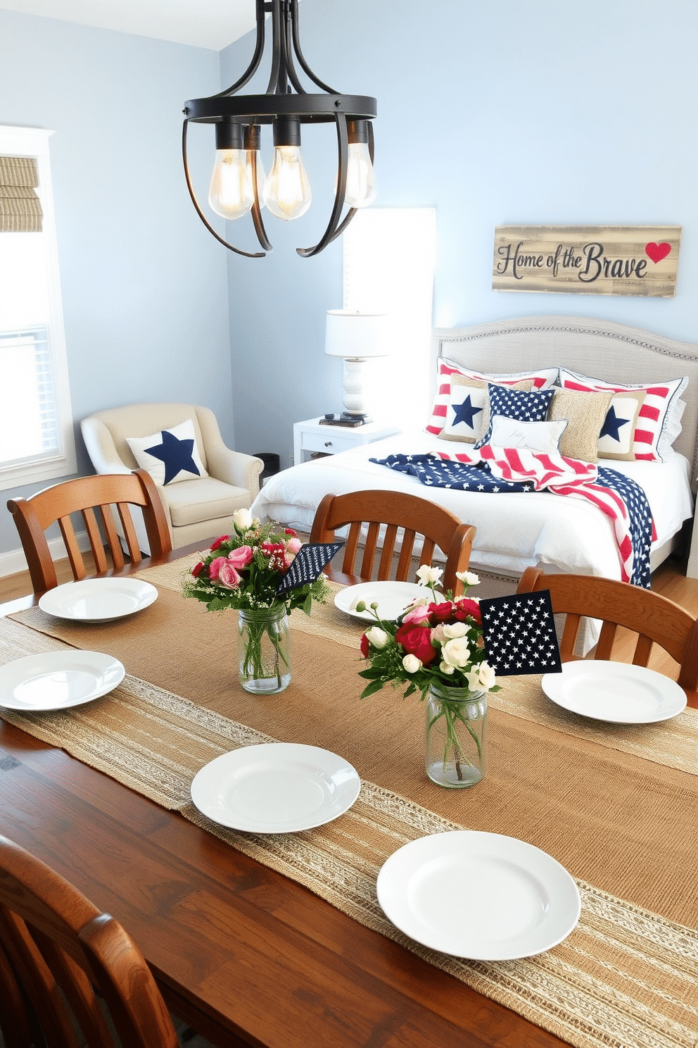 A rustic dining room setup. Burlap and lace table runners are spread across a long wooden table, with vintage white plates and mason jar centerpieces filled with wildflowers. The room features wooden chairs with burlap seat cushions, and a large chandelier with Edison bulbs hangs overhead. A patriotic bedroom designed for Memorial Day. The bed is dressed in red, white, and blue linens with star-patterned throw pillows. Above the headboard, a wooden sign with the phrase 