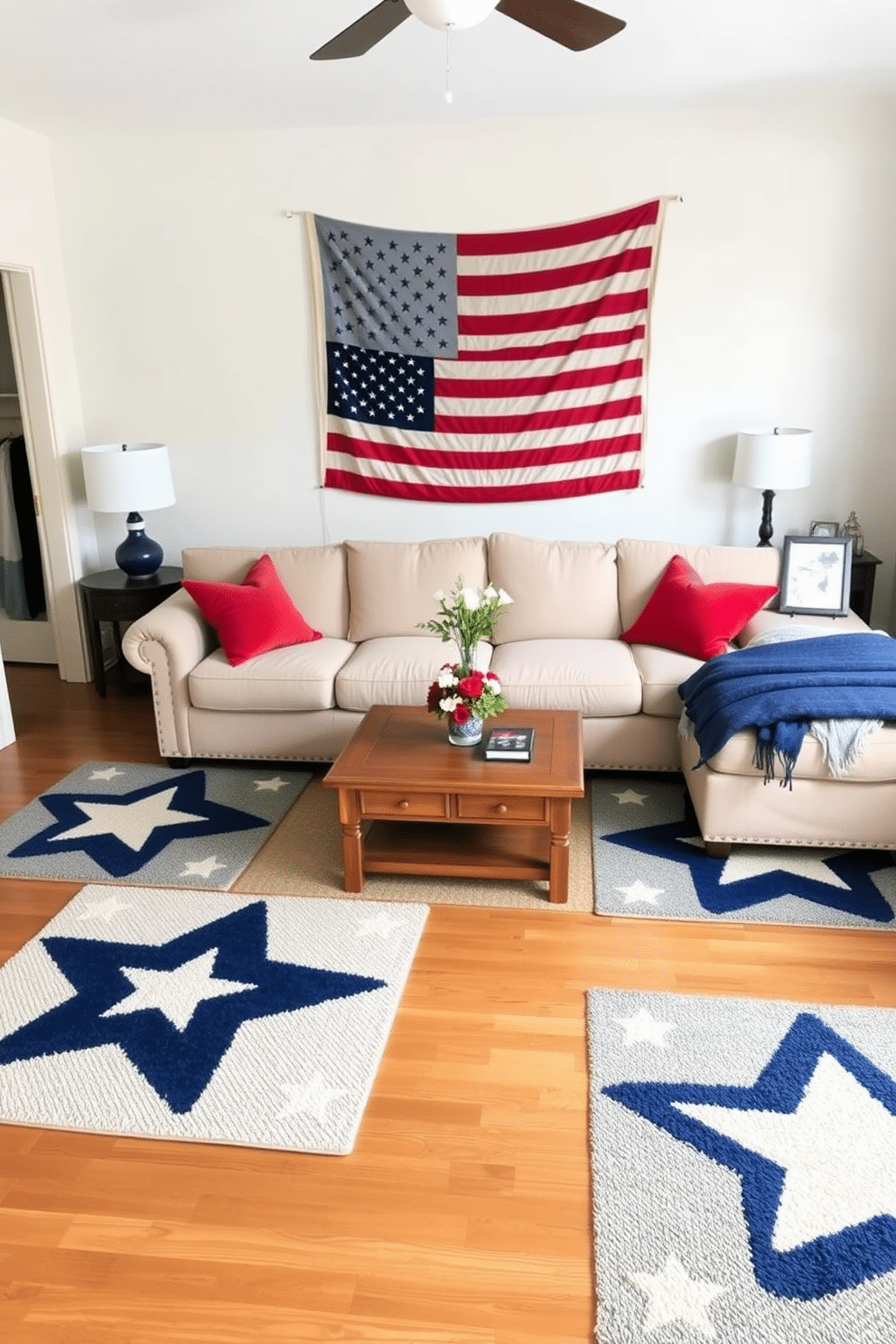 A cozy living room adorned with star-patterned rugs in shades of navy and cream. The rugs are placed under a plush beige sectional sofa, with a wooden coffee table in the center, creating a warm and inviting atmosphere. A Memorial Day bedroom decorated with patriotic flair. The bed is dressed in crisp white linens with red and blue throw pillows, while a vintage American flag hangs above the headboard, and a small wooden nightstand displays a vase of fresh flowers and a framed family photo.