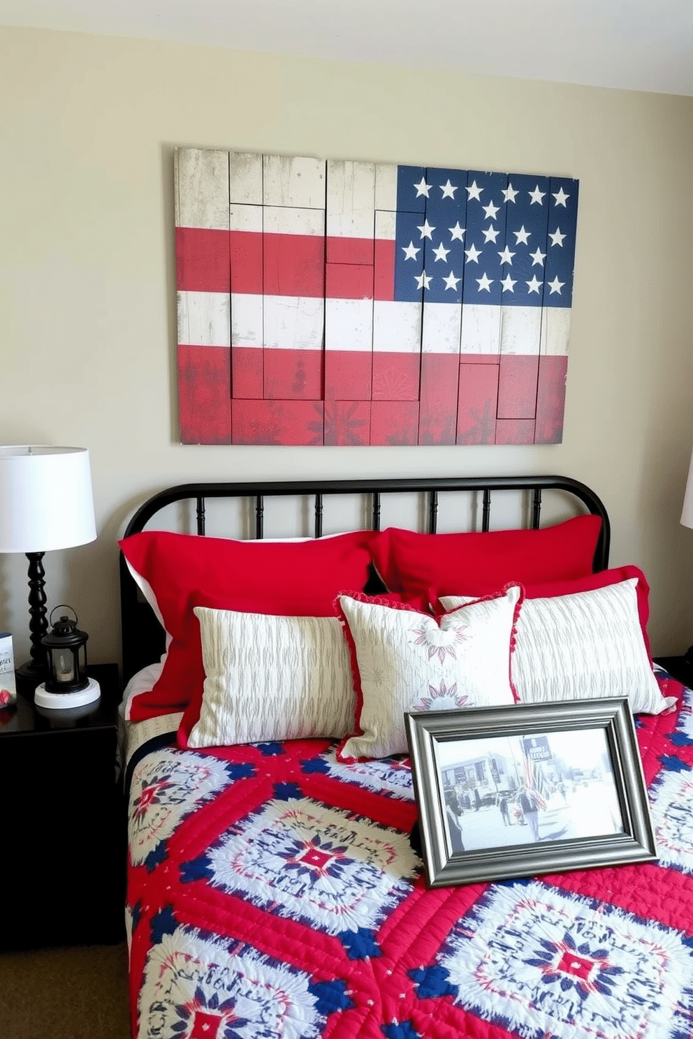 A cozy bedroom with a Memorial Day theme. Above the bed, there's a large piece of artwork featuring the American flag in a rustic, vintage style, adding a patriotic touch to the room. The bed is adorned with red, white, and blue pillows and a matching quilt. On the nightstand, there's a small decorative lantern and a framed photo of a Memorial Day parade, completing the festive look.