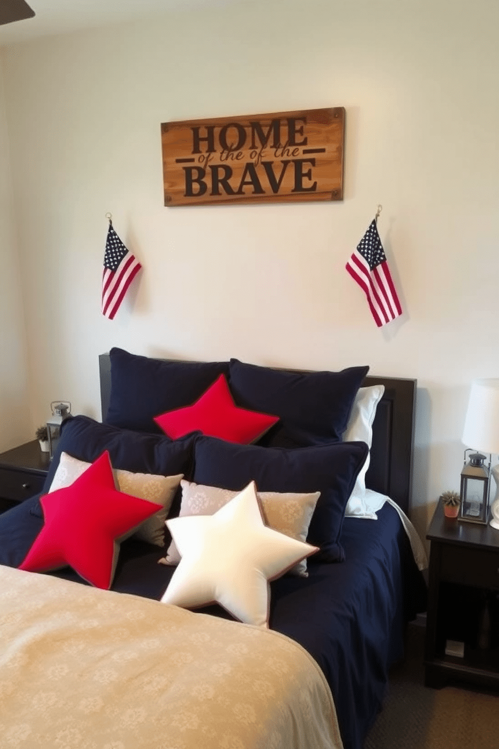 A cozy bedroom with a patriotic theme. The bed is adorned with star-shaped decorative pillows in red, white, and blue, complemented by a navy blue comforter. Above the bed, a wooden sign with the words 