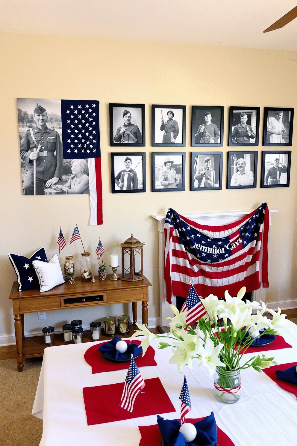 A Memorial Day photo display on the wall. There are several black and white framed photos of soldiers and American flags, arranged in a grid pattern. The wall is painted in a soft beige color, providing a neutral backdrop that highlights the photos. Below the display, a wooden console table holds a few small American flags in glass jars, along with a vintage lantern. Memorial Day decorating ideas. The living room is adorned with red, white, and blue throw pillows on a neutral-colored sofa. A large American flag is draped over the fireplace mantel, accompanied by patriotic-themed candles and small decorative stars. The dining table is set with a white tablecloth, red placemats, and blue napkins, with a centerpiece featuring a bouquet of white lilies and miniature American flags.