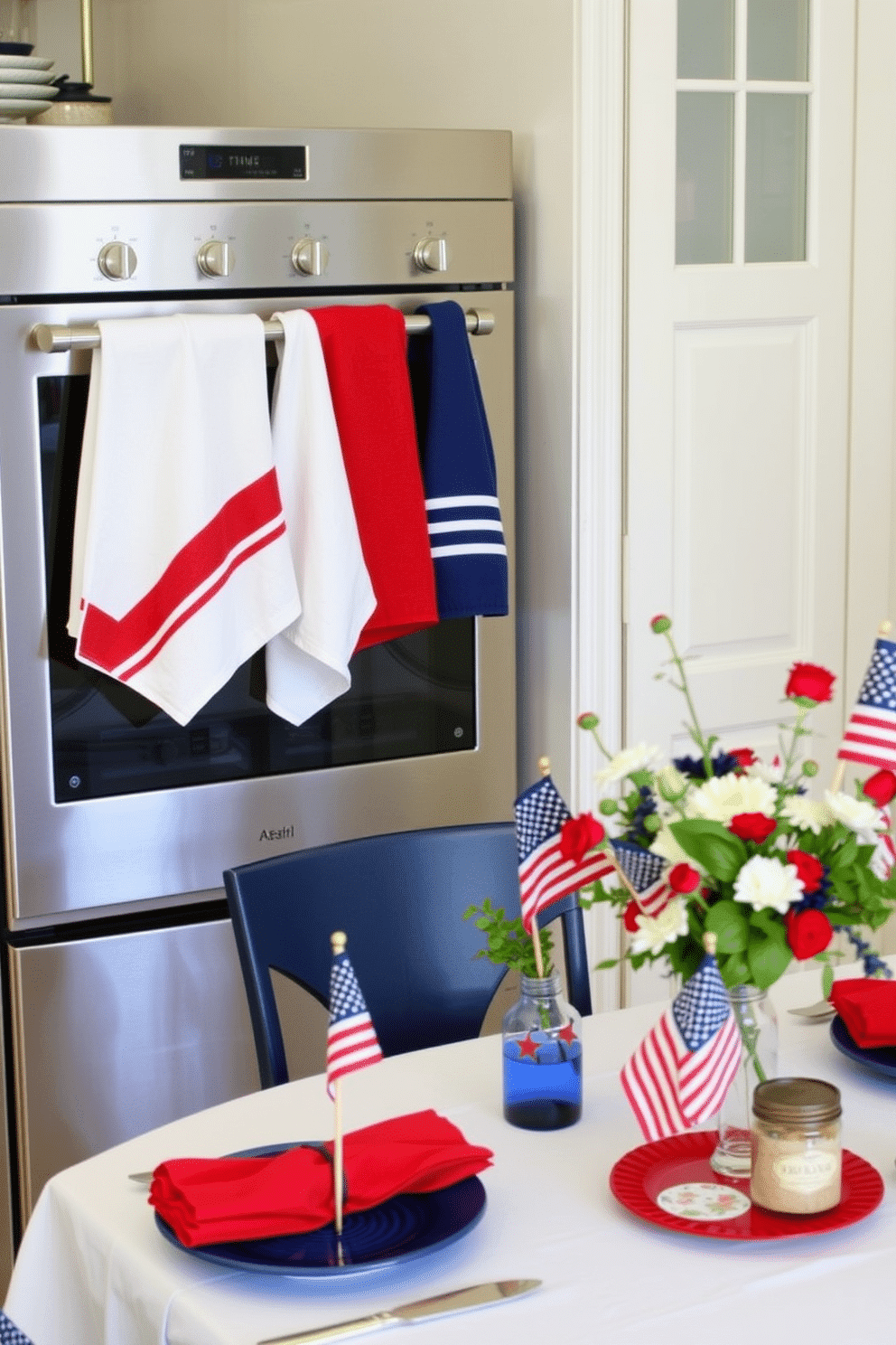 A cozy kitchen adorned with red, white, and blue towels. The towels are neatly hung on a stainless steel rack beside a sleek, modern stove, with one towel featuring a bold red stripe, another with a classic white, and the third with a deep blue. A festive Memorial Day setup with red, white, and blue decorations. The dining table is elegantly set with a white tablecloth, red napkins, and blue plates, complemented by a centerpiece of fresh flowers in patriotic colors and small American flags placed in glass jars.