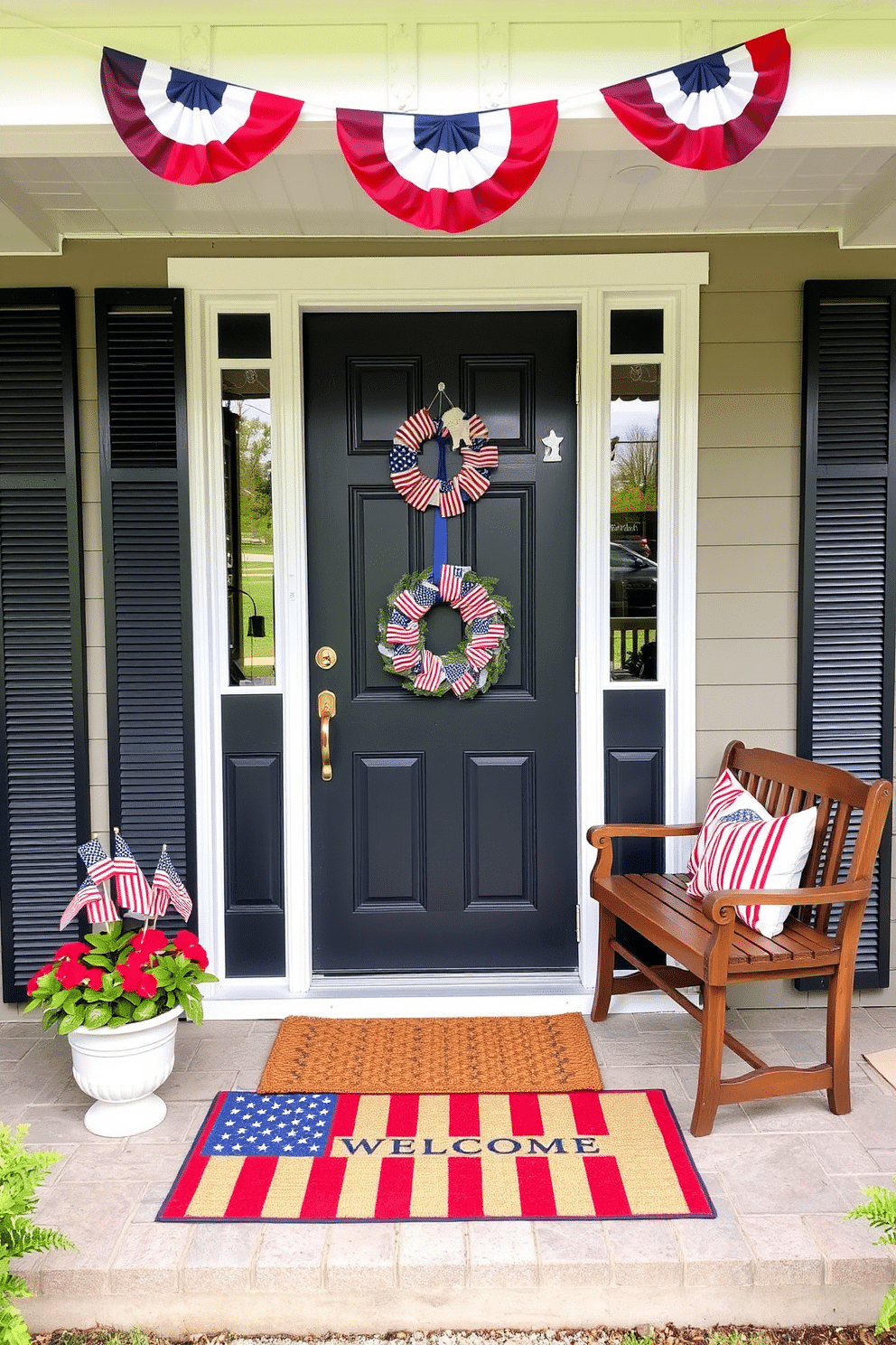 A cozy front porch decorated for Memorial Day. A welcome mat featuring the American flag is placed at the entrance, flanked by two potted plants with red, white, and blue flowers. Above the door, a festive banner with patriotic colors is hung, and a small wooden bench with throw pillows in matching hues sits to the side. The door itself is adorned with a wreath made of miniature American flags, adding a cheerful and inviting touch to the space.