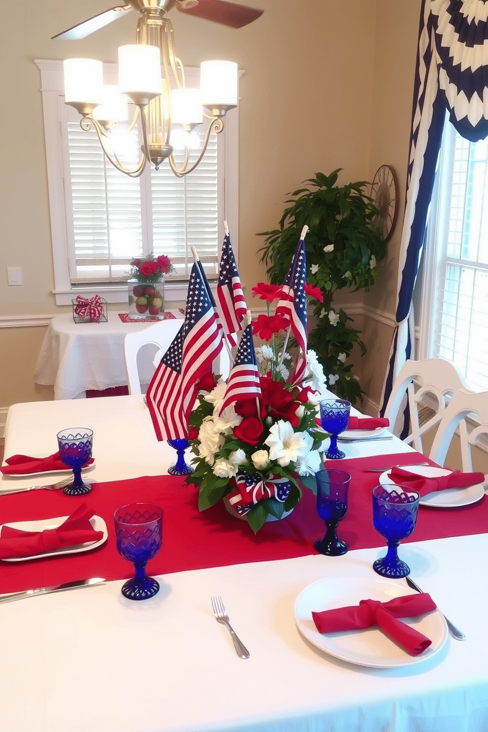 A dining room adorned with red, white, and blue table linens, creating a festive Memorial Day atmosphere. The table is set with white plates, red napkins, and blue glassware, while a patriotic centerpiece featuring American flags and fresh flowers adds a celebratory touch.