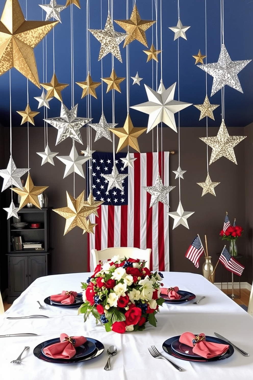 Decorative stars hanging from the ceiling. There are various sizes of stars made from metal and paper, suspended at different heights with thin, nearly invisible strings. The stars have a mix of finishes, including gold, silver, and glitter, catching the light beautifully. The ceiling itself is painted a deep midnight blue, enhancing the celestial theme of the room. Memorial Day dining room decorating ideas. The dining table is adorned with a crisp white tablecloth, with a centerpiece of red, white, and blue flowers. Place settings include blue plates, white napkins with red napkin rings, and silver cutlery. Behind the table, a large American flag is draped on the wall, and small flags are placed in vases around the room.