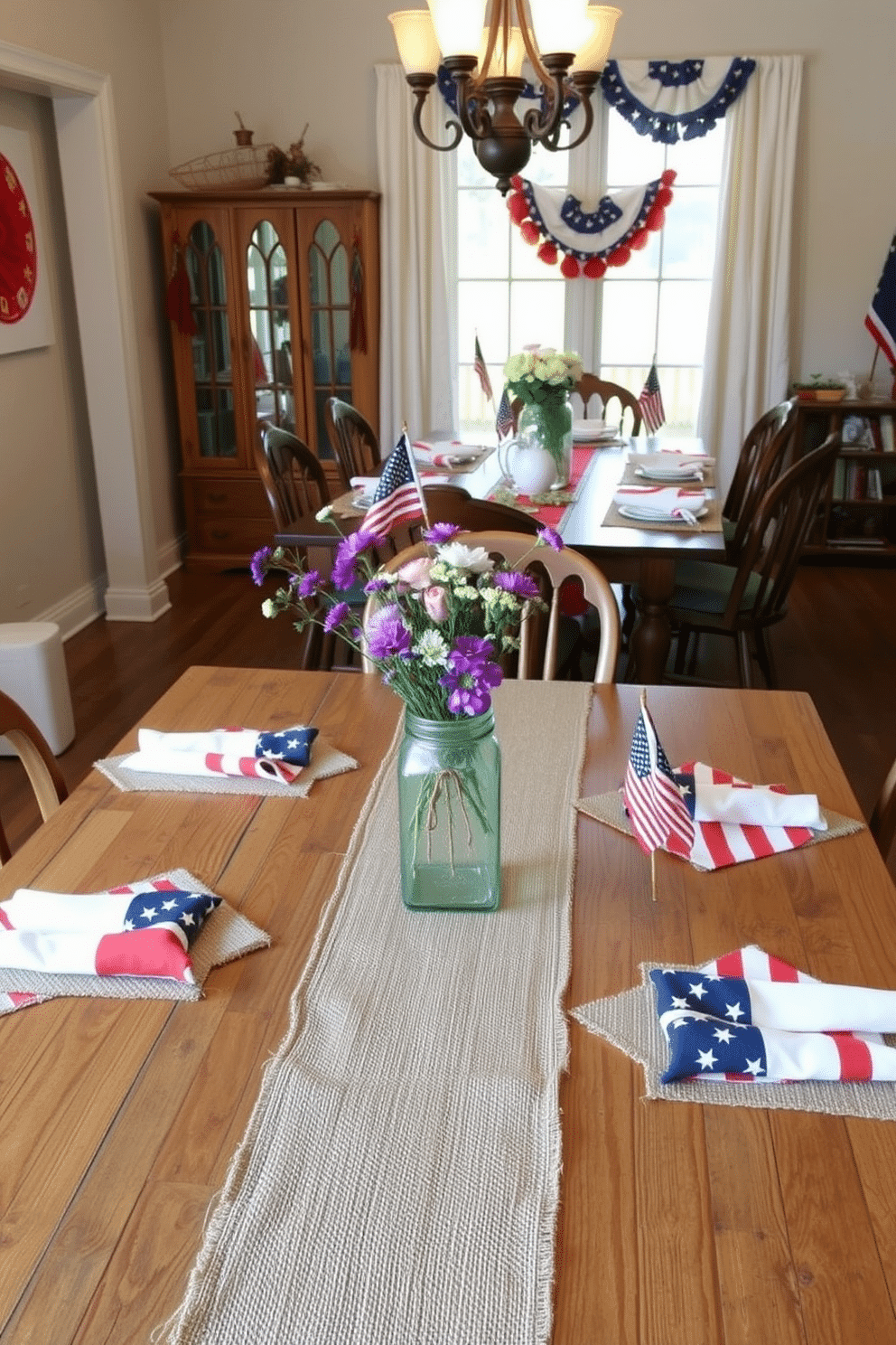 A rustic dining room featuring a wooden table with burlap accents. The table is adorned with a burlap runner, complemented by vintage wooden chairs, and a centerpiece of wildflowers in a mason jar. Celebrate Memorial Day with a dining room decorated in patriotic colors. The table is set with red, white, and blue linens, star-shaped placemats, and small American flags, creating a festive and inviting atmosphere.