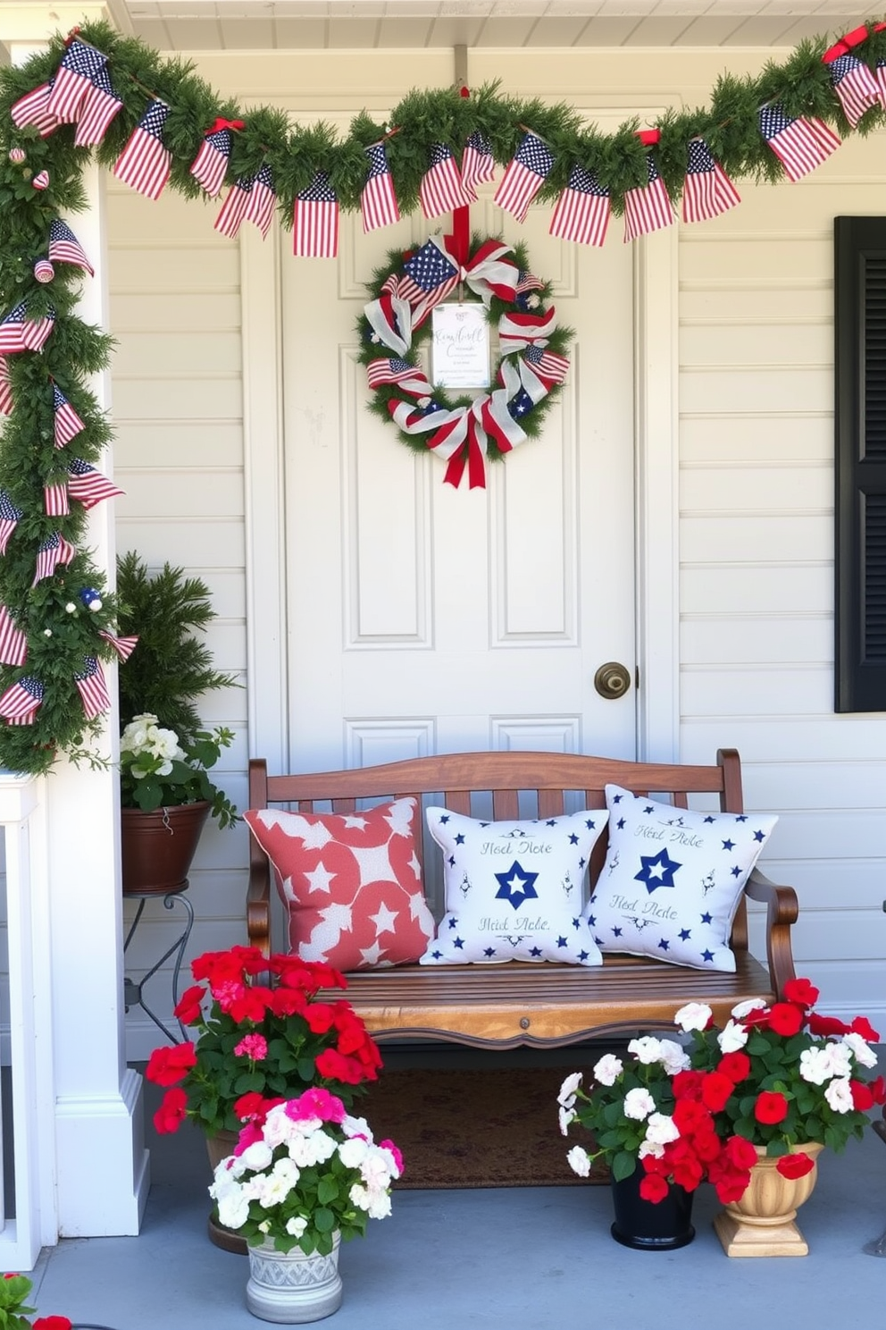 A welcoming entryway adorned for Memorial Day. A seasonal garland with mini American flags drapes elegantly across the doorway, complemented by a patriotic wreath on the front door. Red, white, and blue bunting hangs from the porch railing, and a vintage wooden bench is decorated with star-spangled cushions. Potted plants with red geraniums and white petunias flank the entrance, adding a festive and inviting touch.