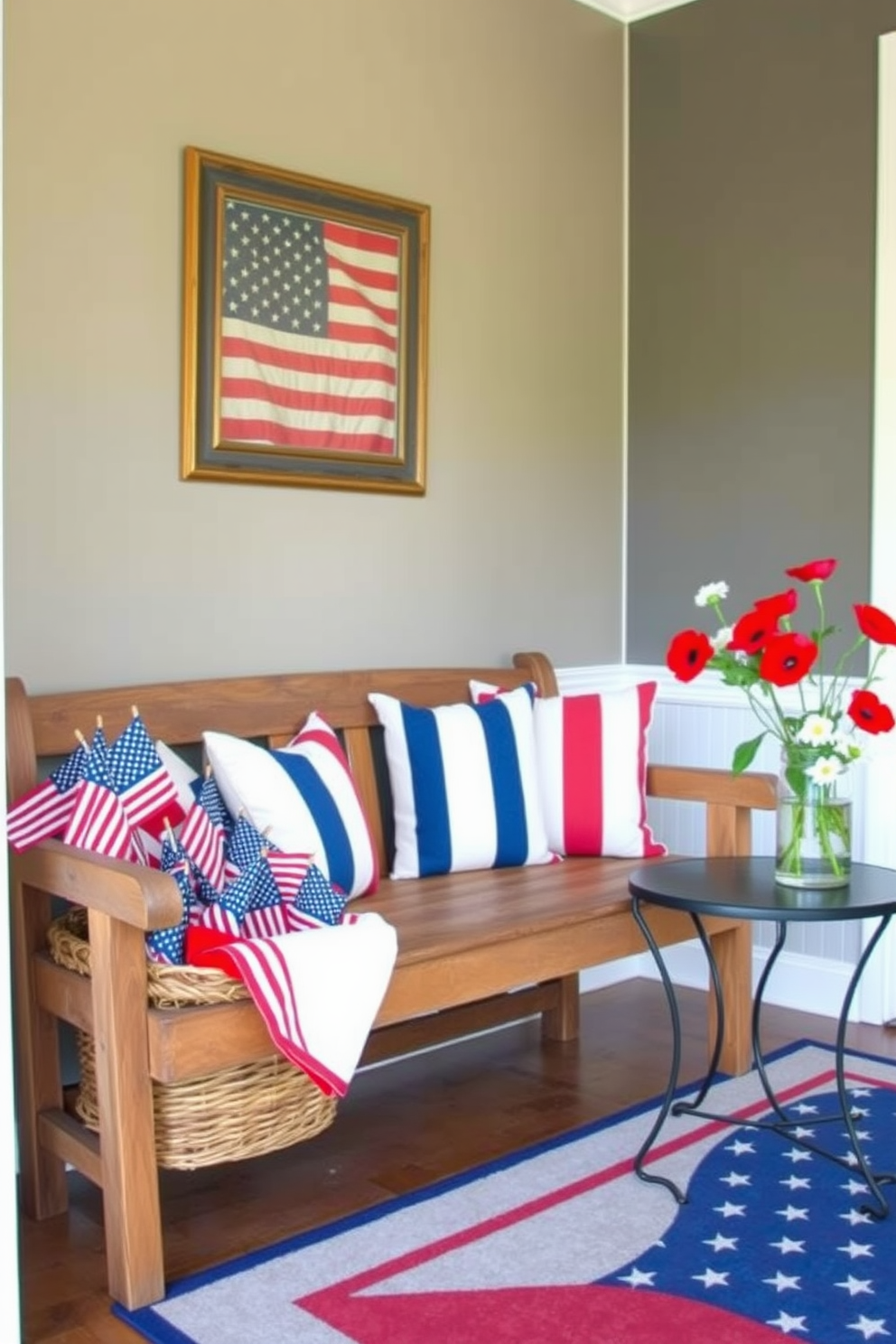 A welcoming entryway decorated for Memorial Day. There's a rustic wooden bench with red, white, and blue cushions, and a woven basket filled with small American flags placed next to it. Above the bench, a large framed print of the American flag hangs on the wall. The floor is adorned with a patriotic-themed rug, and a vase with red poppies and white daisies sits on a small side table.