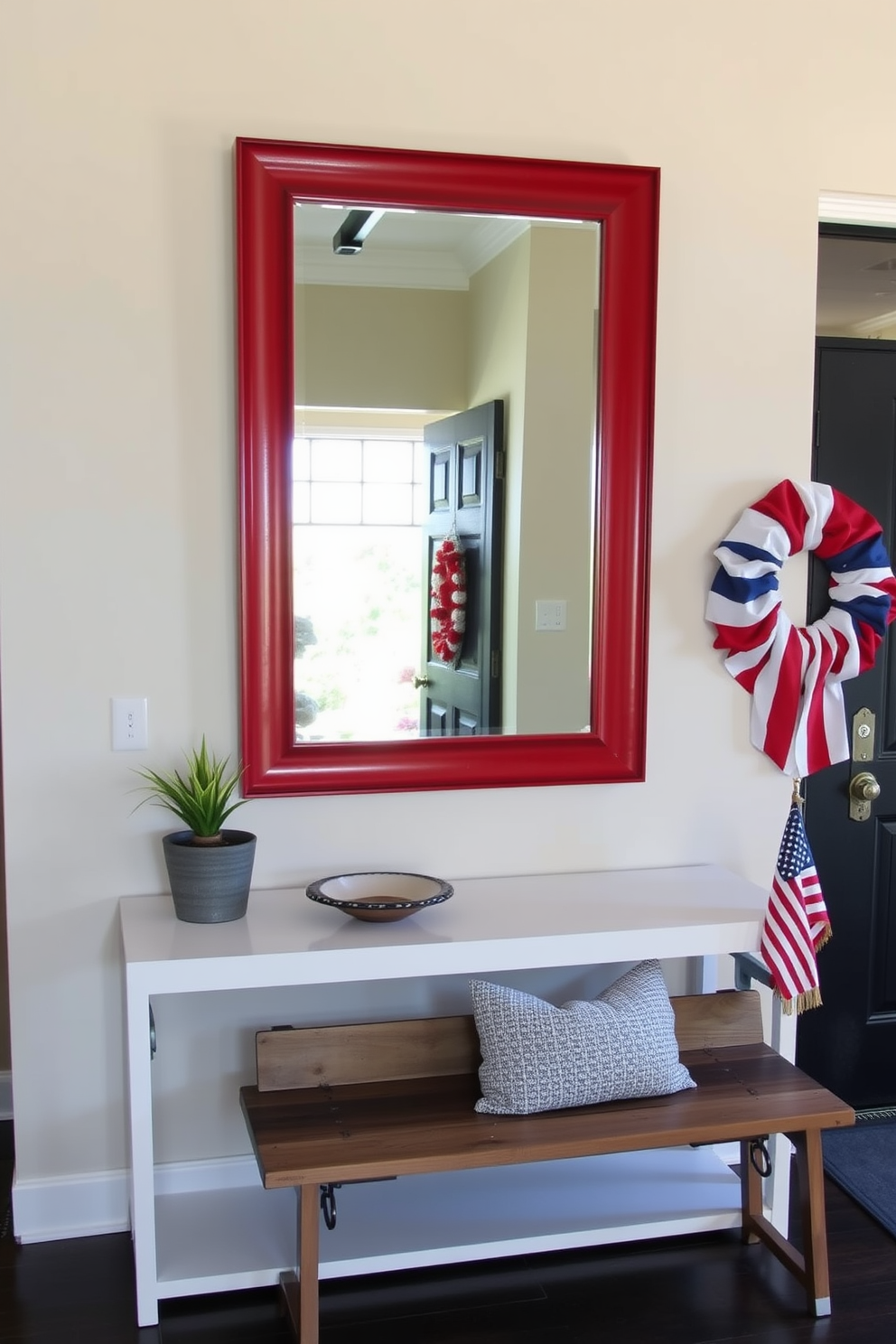 An elegant entryway featuring a large mirror with a bold red frame, positioned above a sleek console table. The table is adorned with a decorative bowl and a small potted plant, while the walls are painted in a soft cream color. A festive Memorial Day entryway decorated with patriotic accents, including a red, white, and blue wreath on the door. A rustic wooden bench is placed against the wall, with a few throw pillows in coordinating colors and a small American flag displayed on the side table.