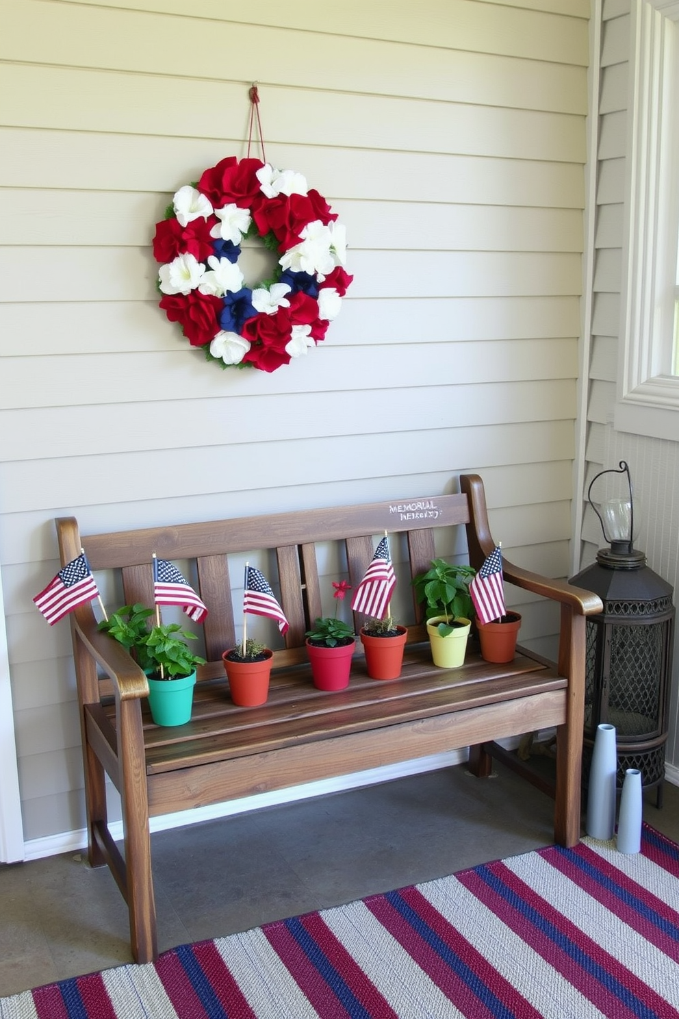 A welcoming entryway decorated for Memorial Day. The entrance features a rustic wooden bench adorned with colorful flower pots, each with small American flags planted in them. On the wall above the bench, a patriotic wreath made of red, white, and blue flowers hangs prominently. The floor is covered with a striped rug in matching colors, and a vintage lantern sits beside the bench, adding a warm, festive glow.