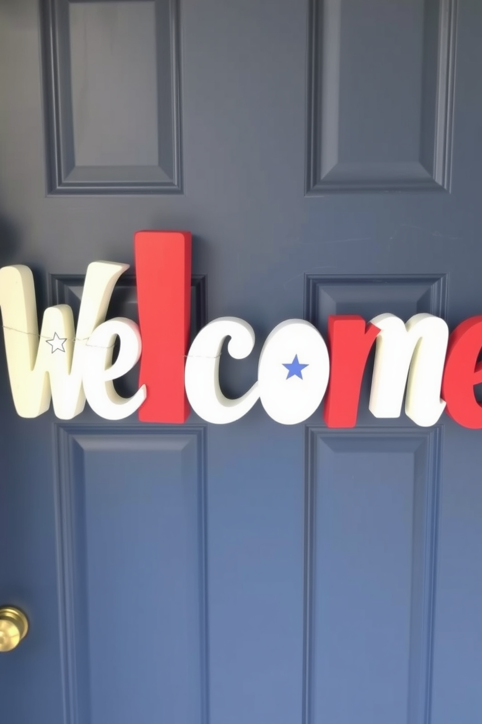 A charming front door display featuring large wooden letters painted in red, white, and blue. The letters are arranged to spell out 