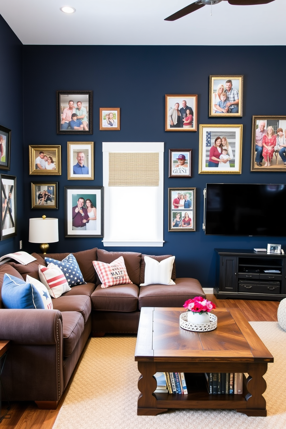 A cozy game room adorned with family photos in patriotic frames celebrating Memorial Day. The walls are painted in a deep navy blue, and a plush sectional sofa is positioned around a rustic wooden coffee table.