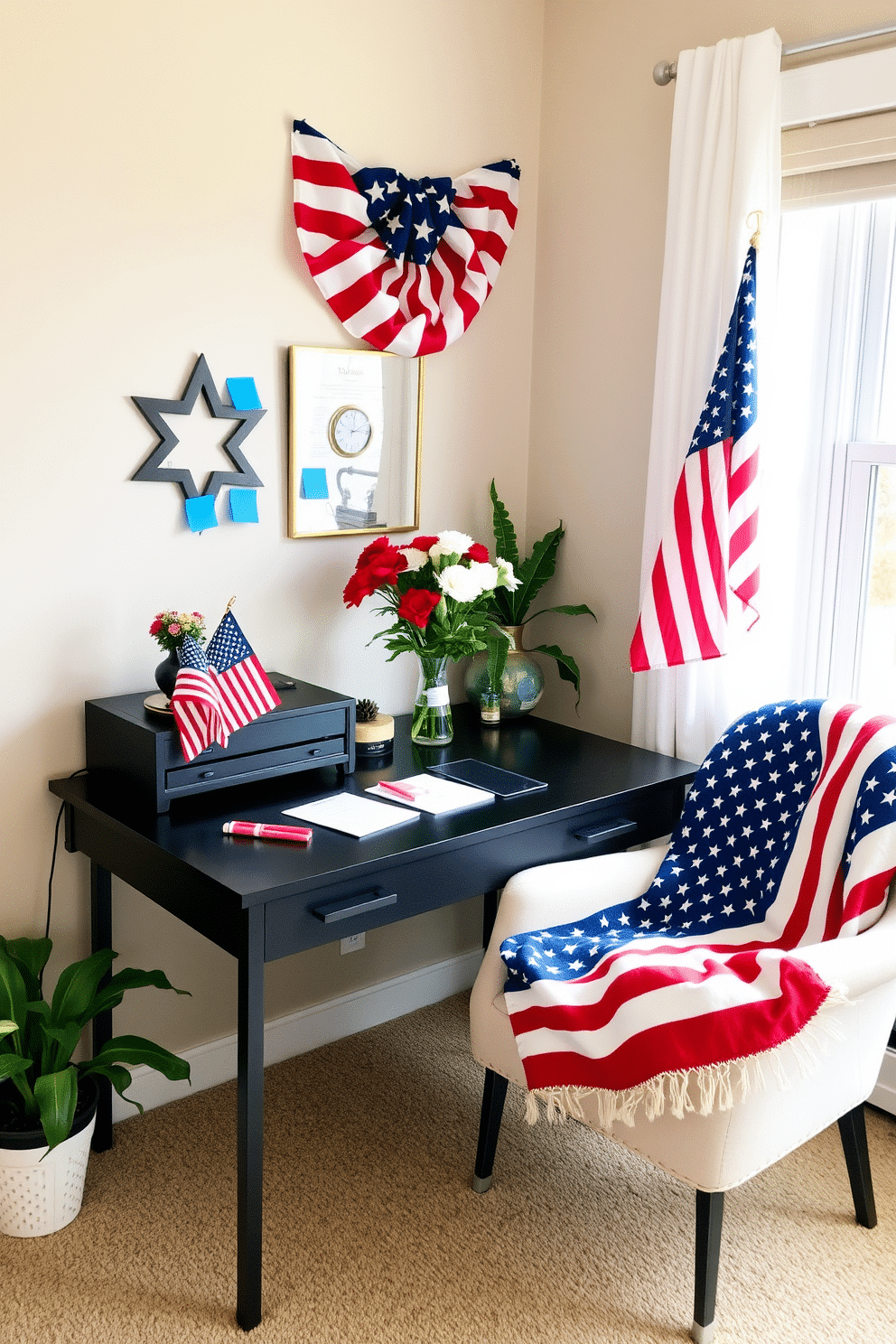 A cozy home office setting decorated for Memorial Day. The desk is adorned with patriotic sticky notes in red white and blue colors, alongside a small American flag and a vase of fresh flowers. The walls are painted in a soft neutral tone, providing a calming backdrop. A comfortable chair is positioned near the window, with a throw blanket featuring stars and stripes draped over it.