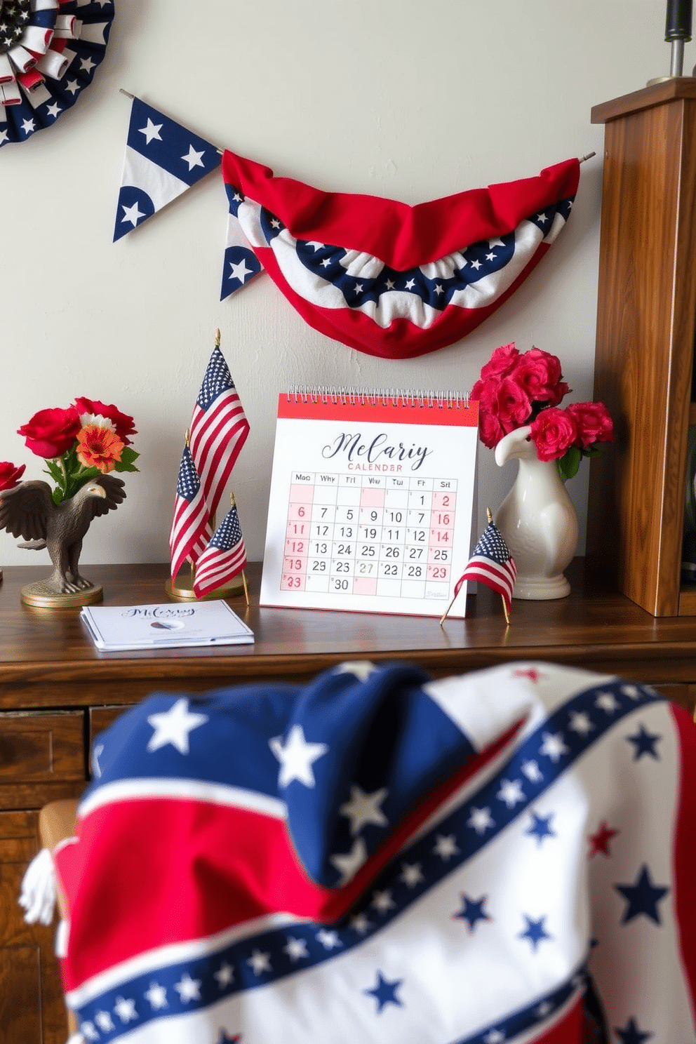 A patriotic themed desk calendar display featuring a red white and blue color scheme. The calendar is placed on a rustic wooden desk surrounded by small American flags and a decorative eagle figurine. For Memorial Day home office decorating ideas consider incorporating star spangled banners and seasonal flowers in red white and blue. A cozy throw blanket with patriotic patterns drapes over the chair adding a festive touch to the workspace.