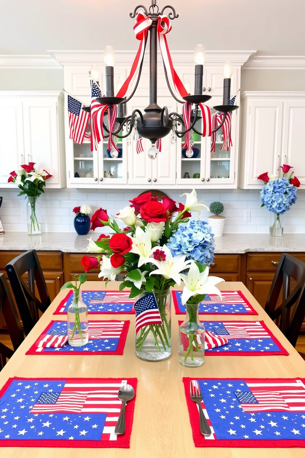 A bright and inviting kitchen decorated for Memorial Day. The table is set with themed placemats featuring patriotic designs, showcasing American flags, stars, and stripes in red, white, and blue hues. Above the table, a chandelier is adorned with small American flags and red, white, and blue ribbons. The countertops are decorated with vases filled with red roses, white lilies, and blue hydrangeas, creating a festive atmosphere.