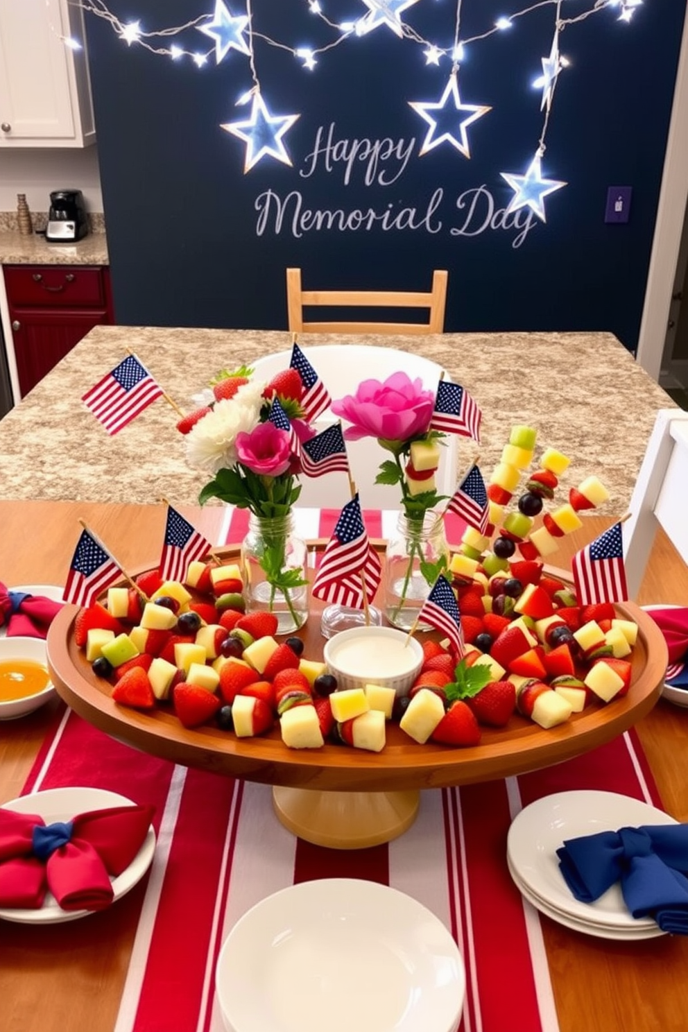 Festive fruit skewers on display. A large wooden platter holds an assortment of colorful fruit skewers, each featuring a combination of strawberries, pineapple chunks, grapes, and kiwi slices. The skewers are arranged in a fan shape, creating a vibrant and appetizing centerpiece. Surrounding the platter, small bowls of dipping sauces and fresh mint leaves add a touch of elegance and flavor. Memorial Day Kitchen Decorating Ideas. A kitchen island is adorned with a red, white, and blue themed tablecloth, setting the stage for a patriotic celebration. Glass jars filled with American flags and fresh flowers in coordinating colors sit at the center, while red and blue napkins are neatly folded beside white plates. String lights in the shape of stars hang above the kitchen counter, casting a festive glow. A chalkboard sign with 