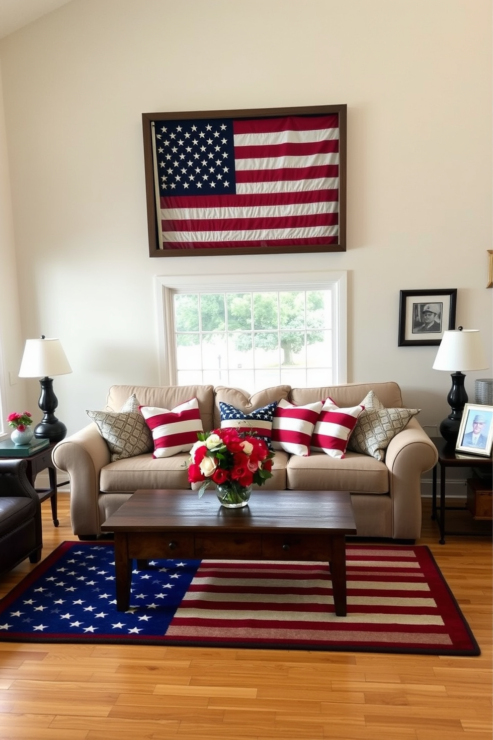 A cozy living room decorated for Memorial Day. A wall-mounted flag display case is the focal point, holding a neatly folded American flag. The room features a large, comfortable beige sofa adorned with red, white, and blue throw pillows. A wooden coffee table sits in front of the sofa, with a centerpiece of fresh flowers in patriotic colors. The walls are painted a soft, neutral tone, and a large window lets in plenty of natural light. An American flag-themed rug covers the hardwood floor, and a framed photo of a veteran is displayed on a side table.