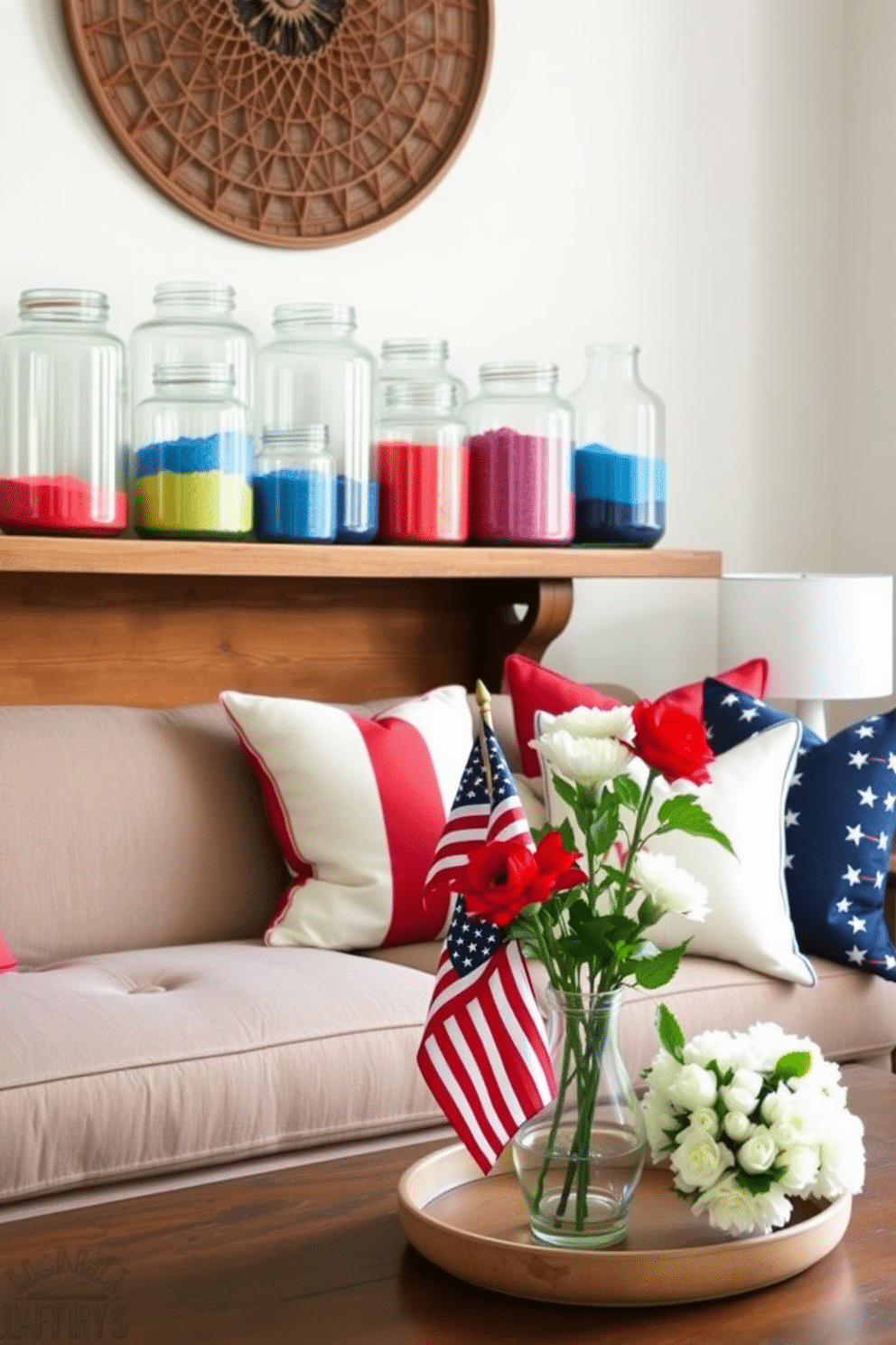 A collection of decorative jars filled with vibrant colored sand is arranged on a rustic wooden shelf. The jars vary in size and shape, showcasing an array of colors that evoke a sense of warmth and creativity. For a Memorial Day loft, the space is adorned with subtle patriotic accents such as red, white, and blue throw pillows on a plush sofa. A table centerpiece features a small American flag alongside fresh flowers in a vintage vase, creating a welcoming and festive atmosphere.