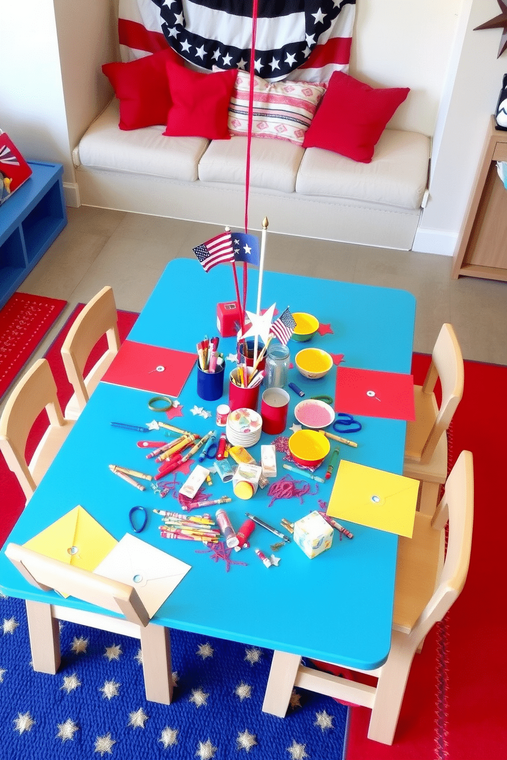 A vibrant kids table is set for holiday crafts and snacks, adorned with colorful tablecloths and cheerful decorations. Scattered around the table are art supplies, including crayons, markers, and glitter, inviting creativity and fun. The playroom is decorated with a Memorial Day theme, featuring red, white, and blue accents throughout the space. Cushions and rugs in patriotic colors create a cozy area for children to gather and enjoy festive activities.