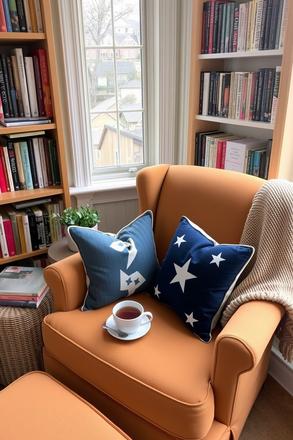 A cozy armchair is positioned by the window, inviting relaxation with its soft fabric and warm color. Surrounding the chair are shelves filled with books and a small side table holding a steaming cup of tea. Decorative pillows in patriotic colors add a festive touch for Memorial Day. A woven throw is draped over the arm of the chair, enhancing the inviting atmosphere of this reading nook.