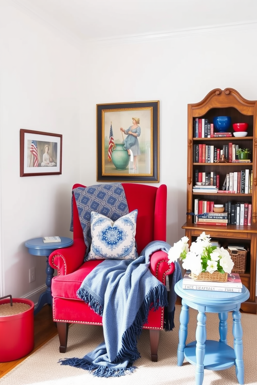 A cozy reading nook inspired by a red white and blue color scheme. The walls are painted a soft white, while a plush red armchair is positioned next to a small blue side table. A decorative throw blanket in blue drapes over the armchair, and a collection of red and white pillows adds comfort. A vintage bookshelf filled with books and patriotic decor completes the inviting atmosphere.