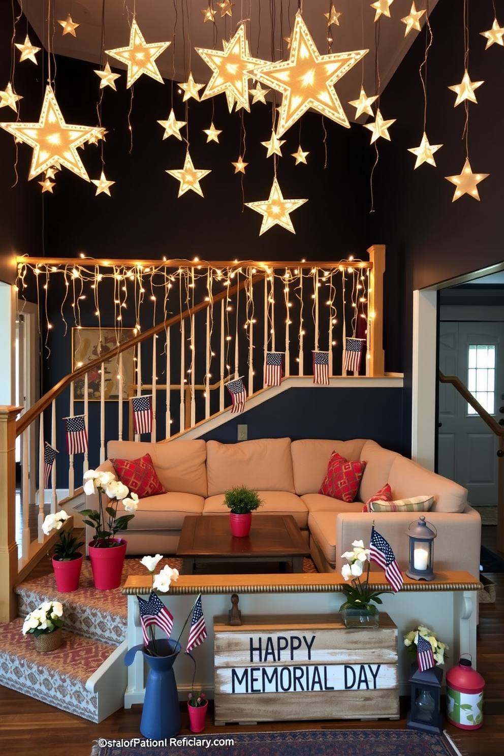 A cozy living room with hanging stars from the ceiling. The stars are made of warm, glowing lights and are suspended at varying lengths to create a whimsical, enchanting atmosphere. Below, a plush sectional sofa in a soft beige color is arranged around a rustic wooden coffee table. The walls are painted in a deep navy blue, enhancing the starry effect, and a large, patterned area rug adds texture and warmth to the space. A patriotic Memorial Day staircase decorated with red, white, and blue accents. The banister is wrapped with a garland of small American flags interspersed with twinkling fairy lights. Each step features a potted plant in a red or blue container, with white flowers blooming brightly. At the base of the staircase, a wooden sign reading 